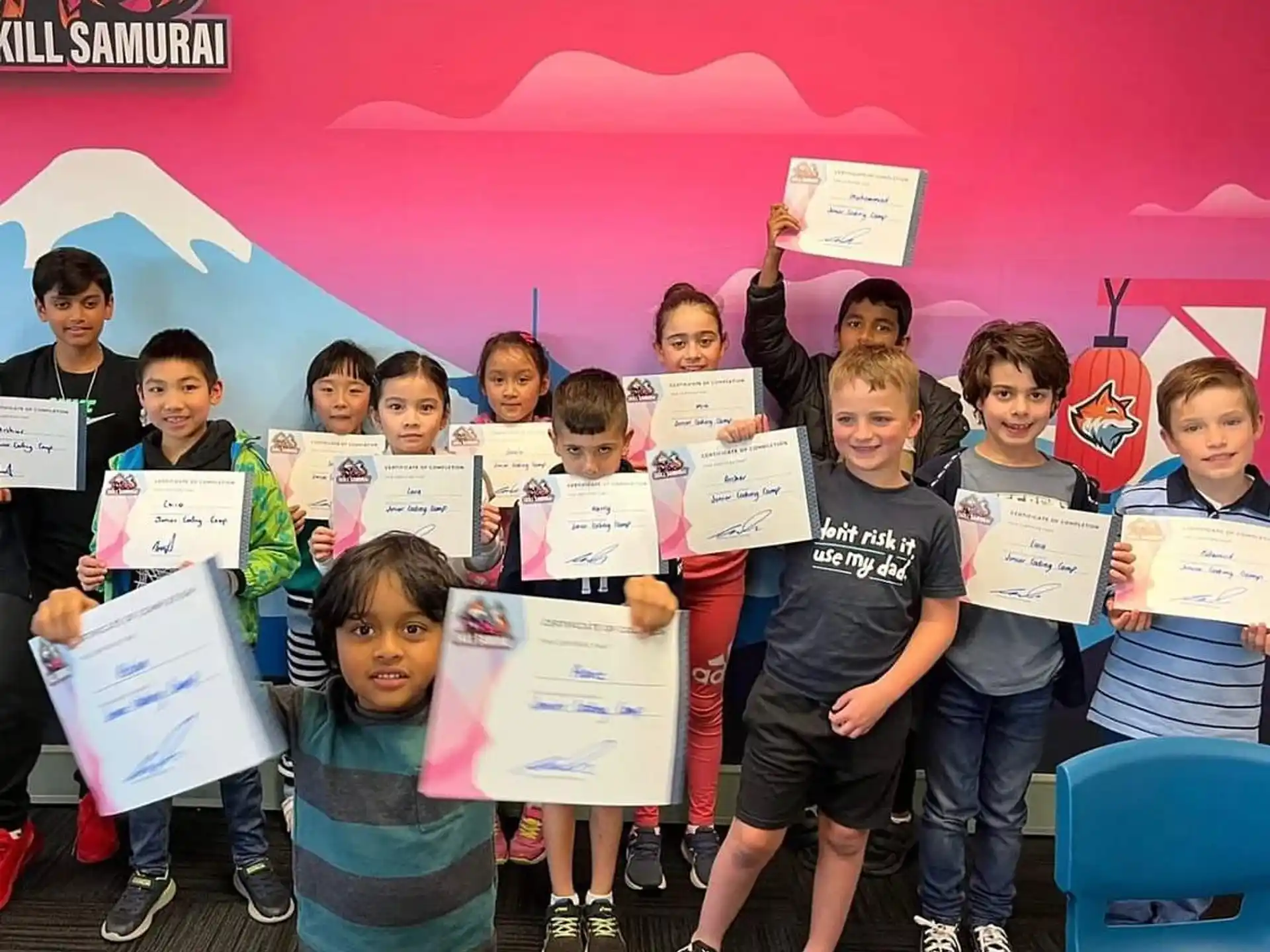 a group of kids holding signs