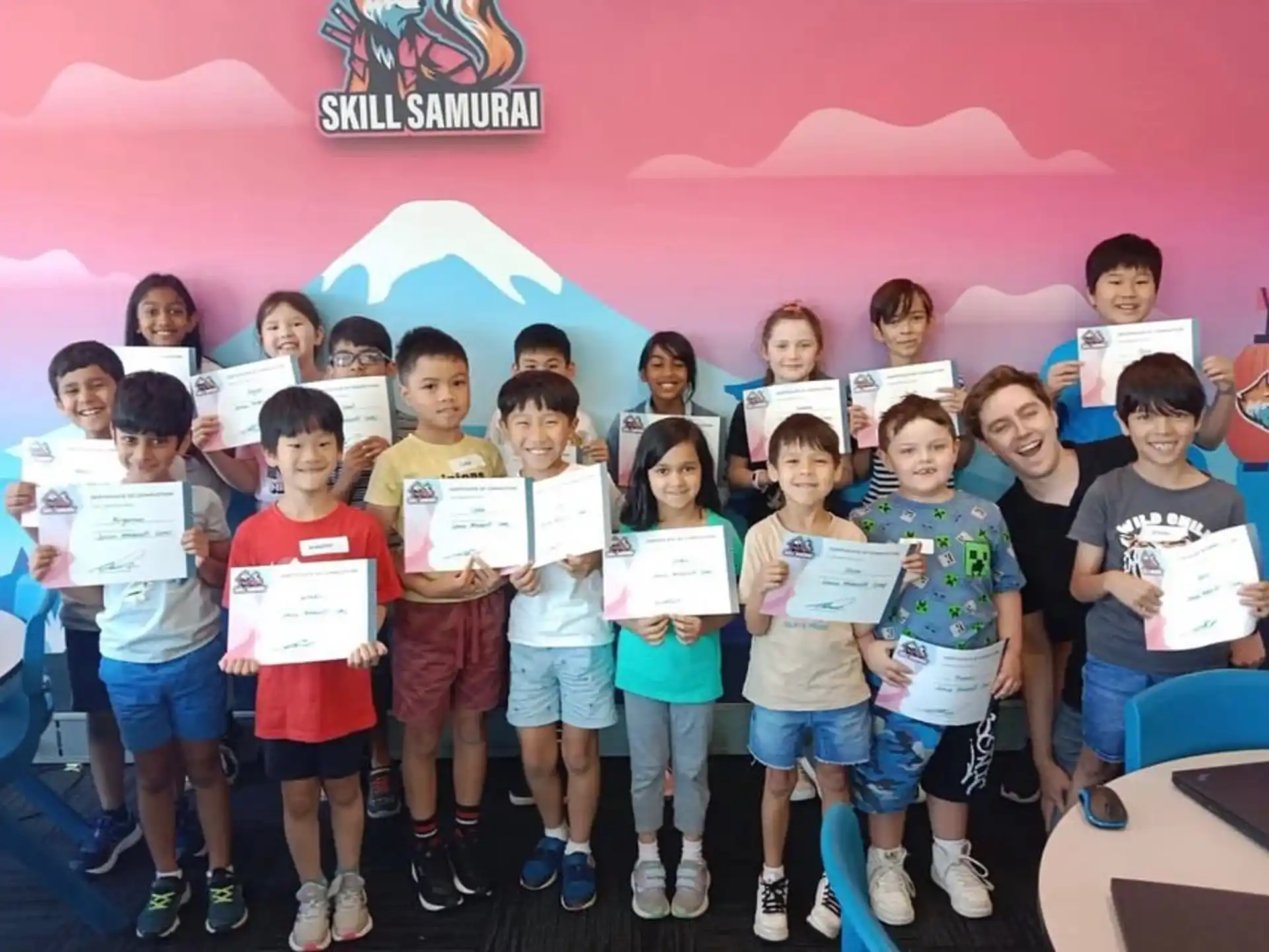 a group of children holding certificates