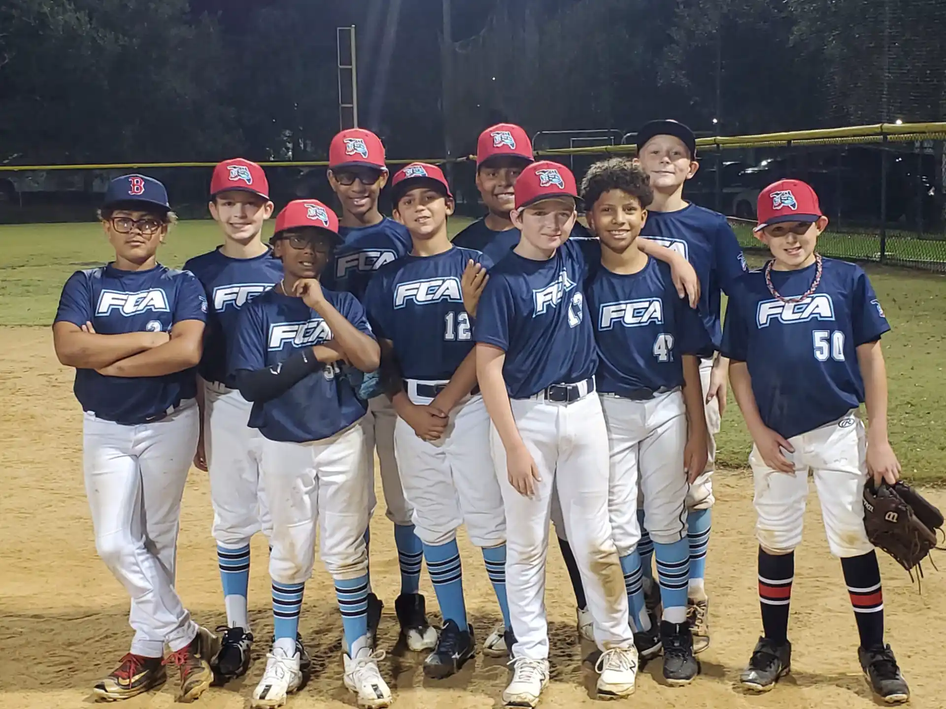 a group of kids in baseball uniforms