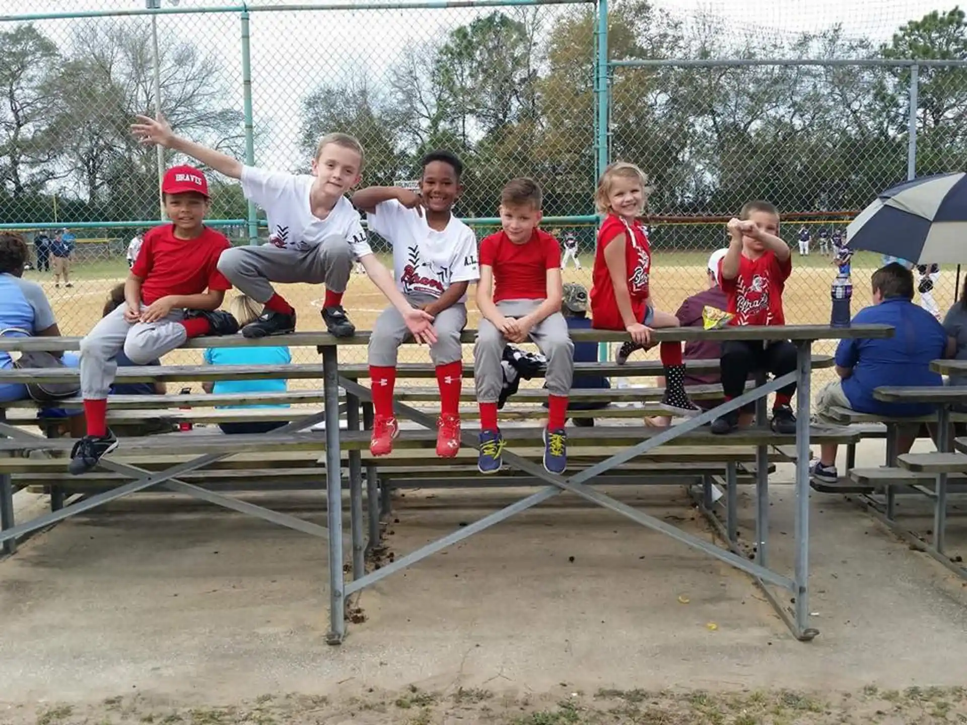 a group of kids sitting on a bench