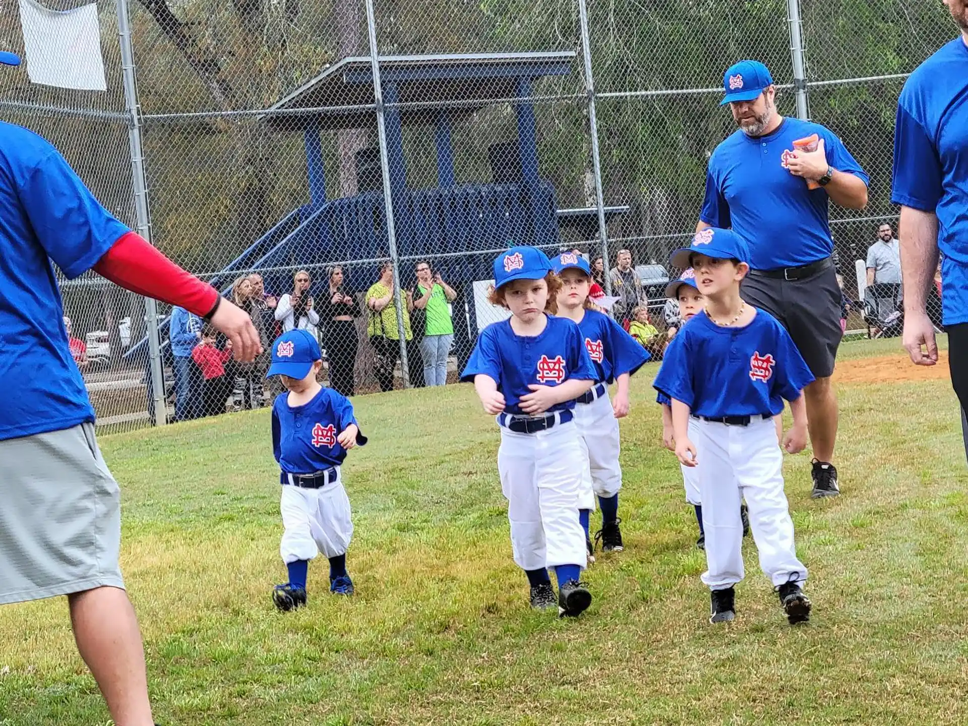 a group of kids in baseball uniforms