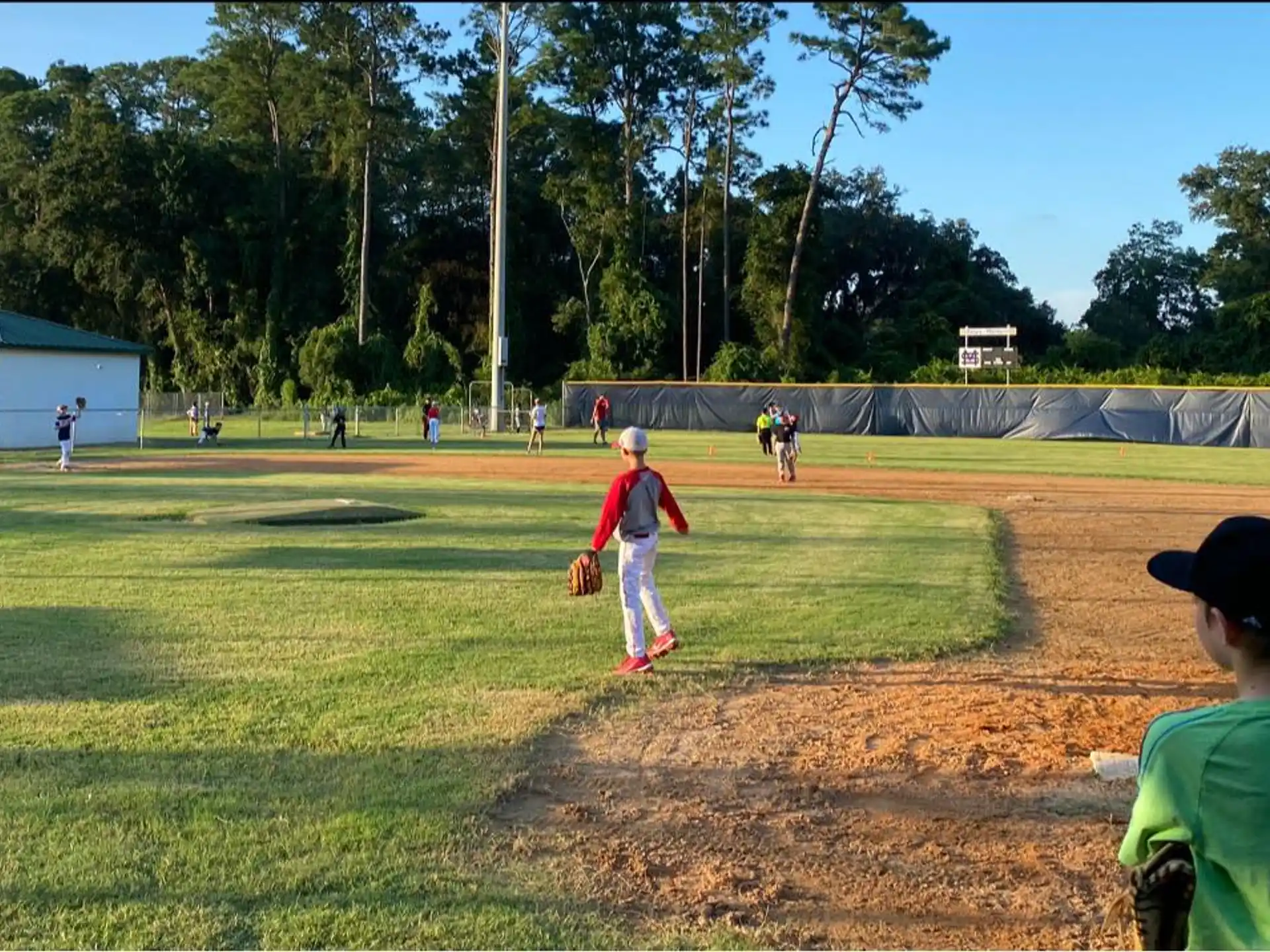 a group of people playing baseball