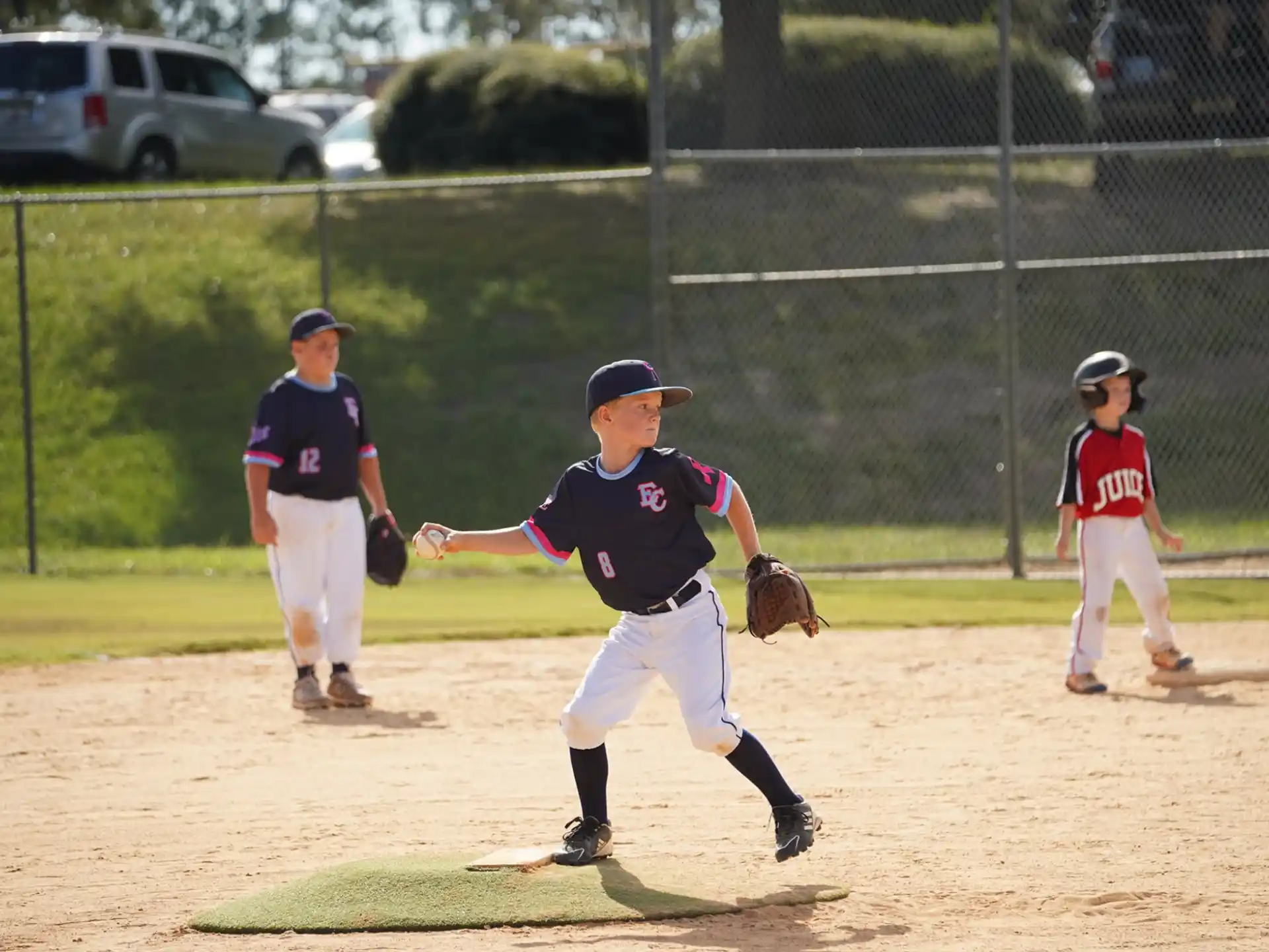 a kid pitching a baseball