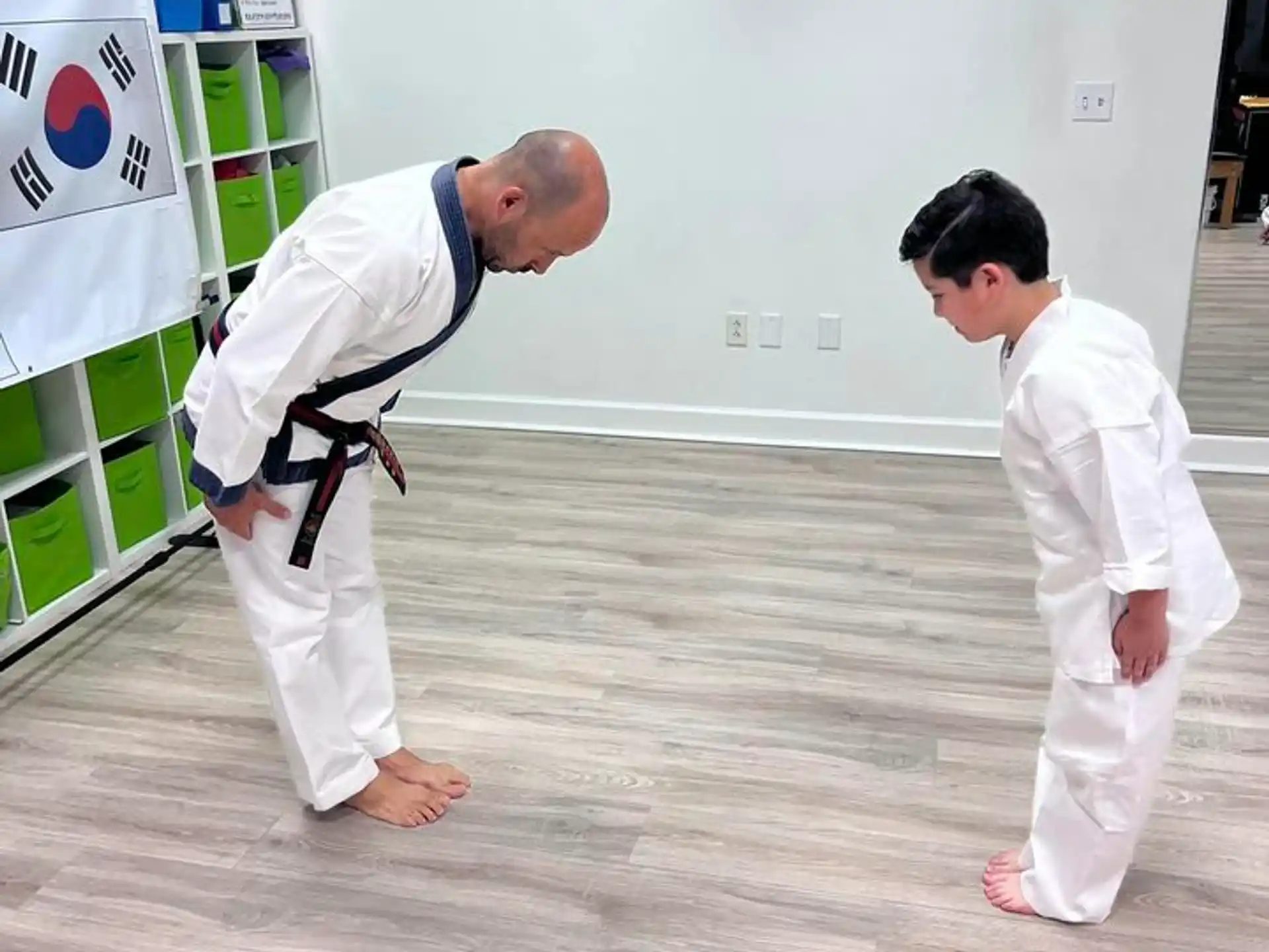a couple of men in karate uniforms