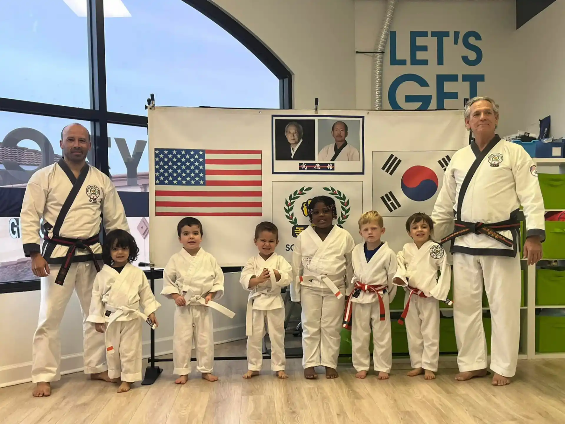 a group of people in karate uniforms