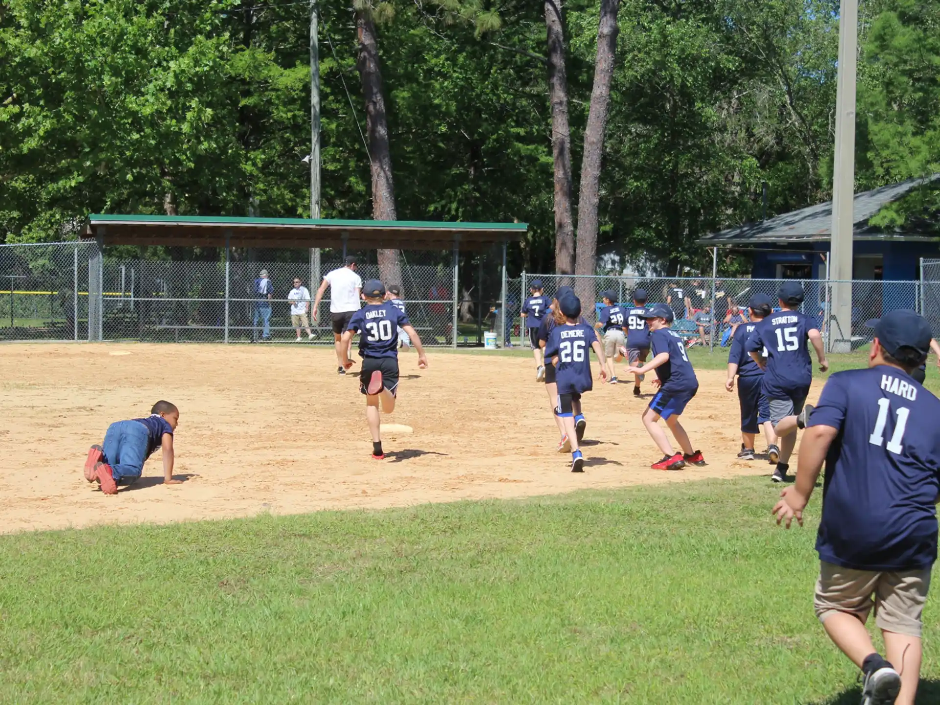 a group of people playing baseball