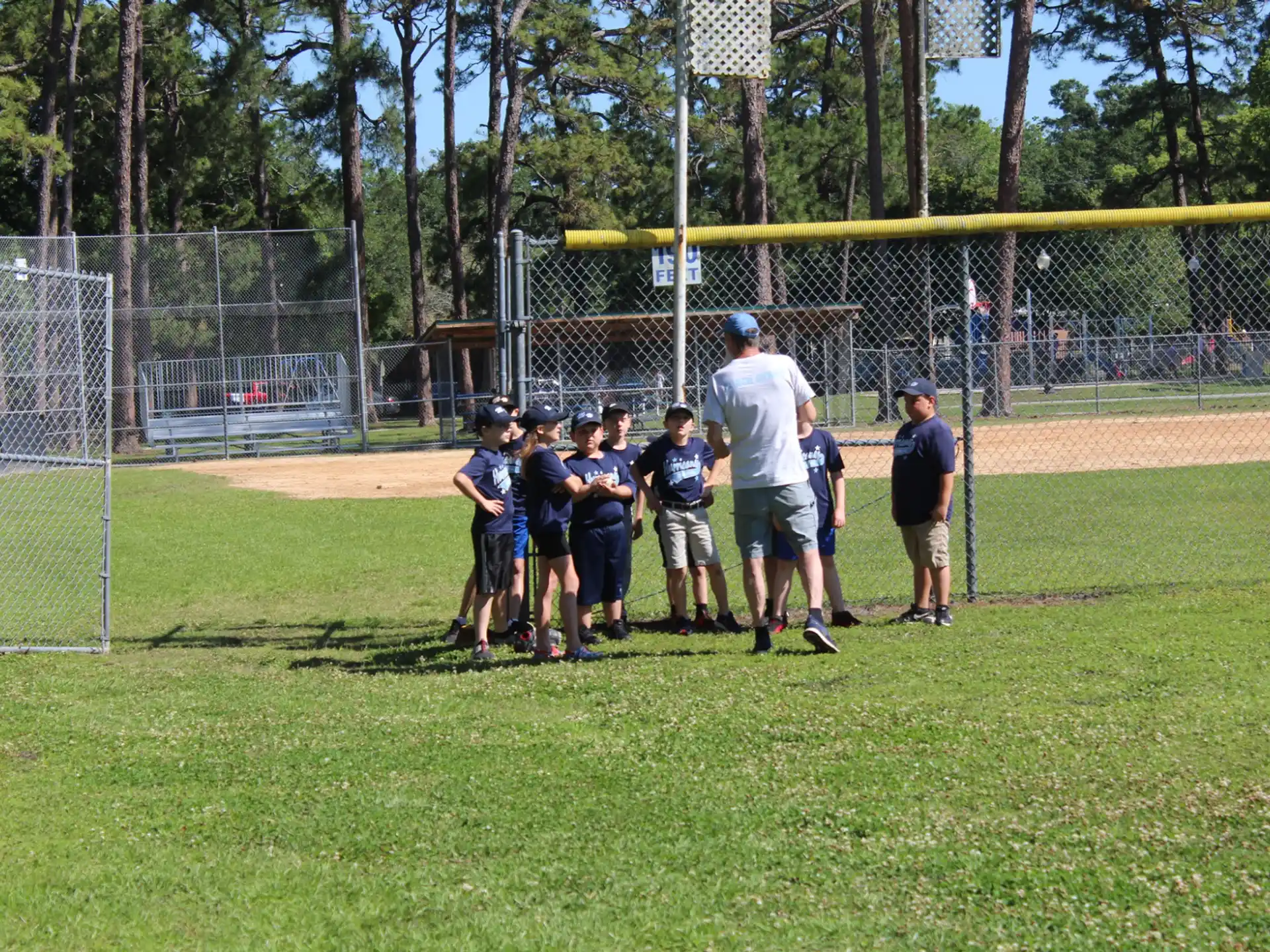 a group of people standing on a field