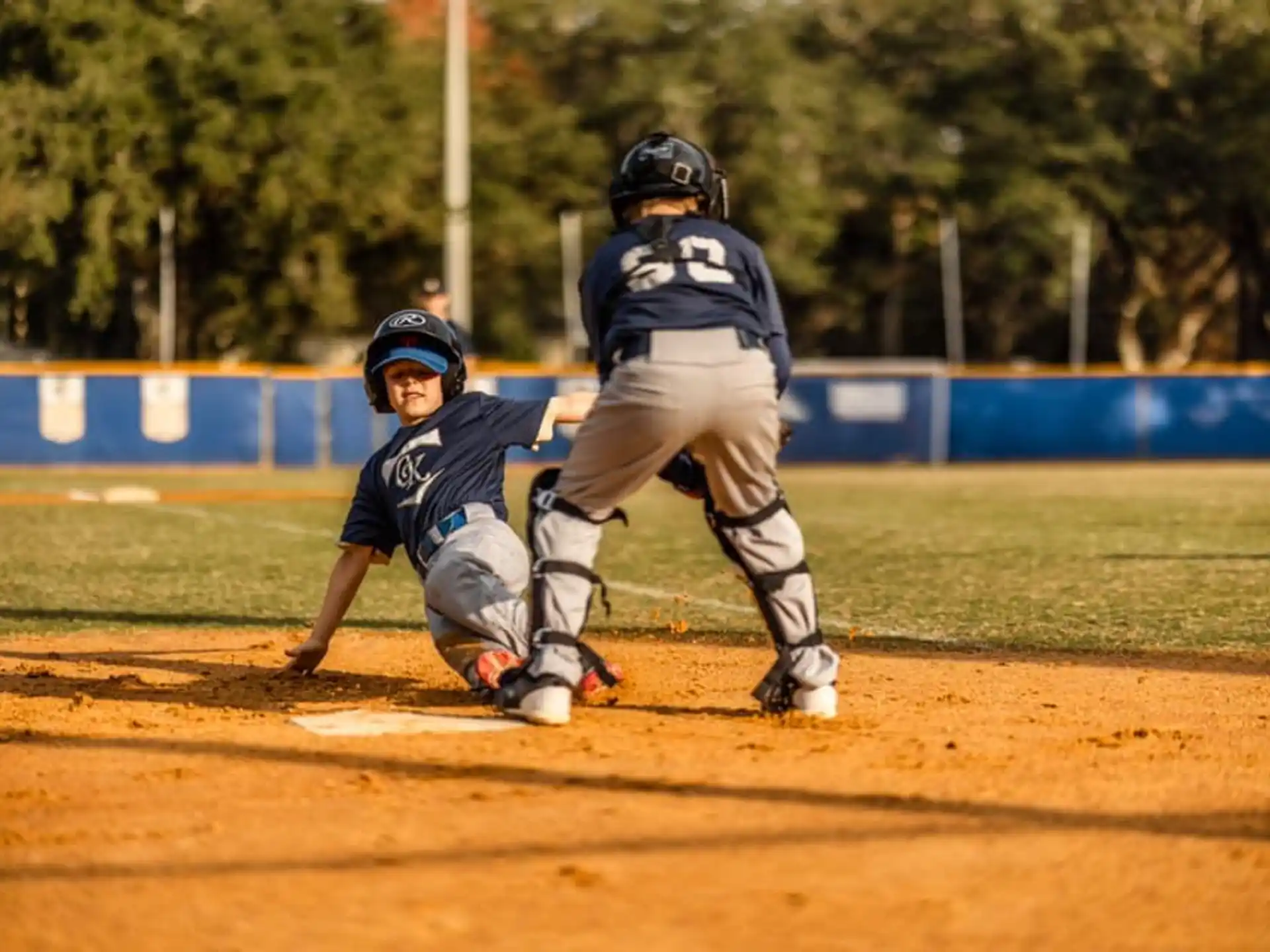 a baseball player sliding into home plate