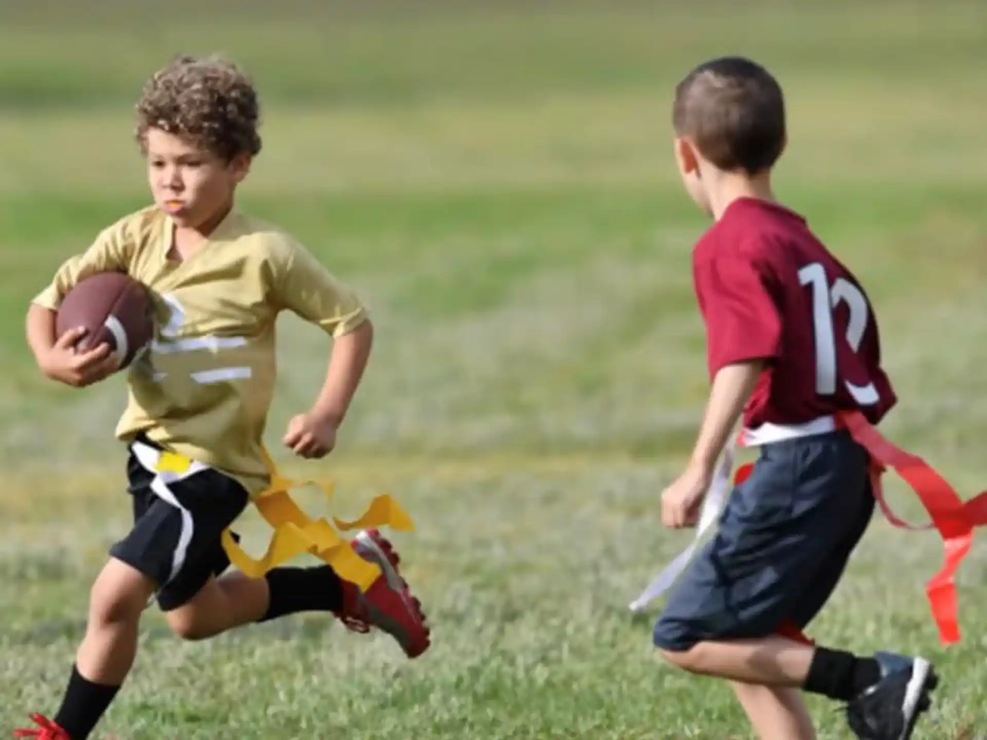 a couple of boys playing football