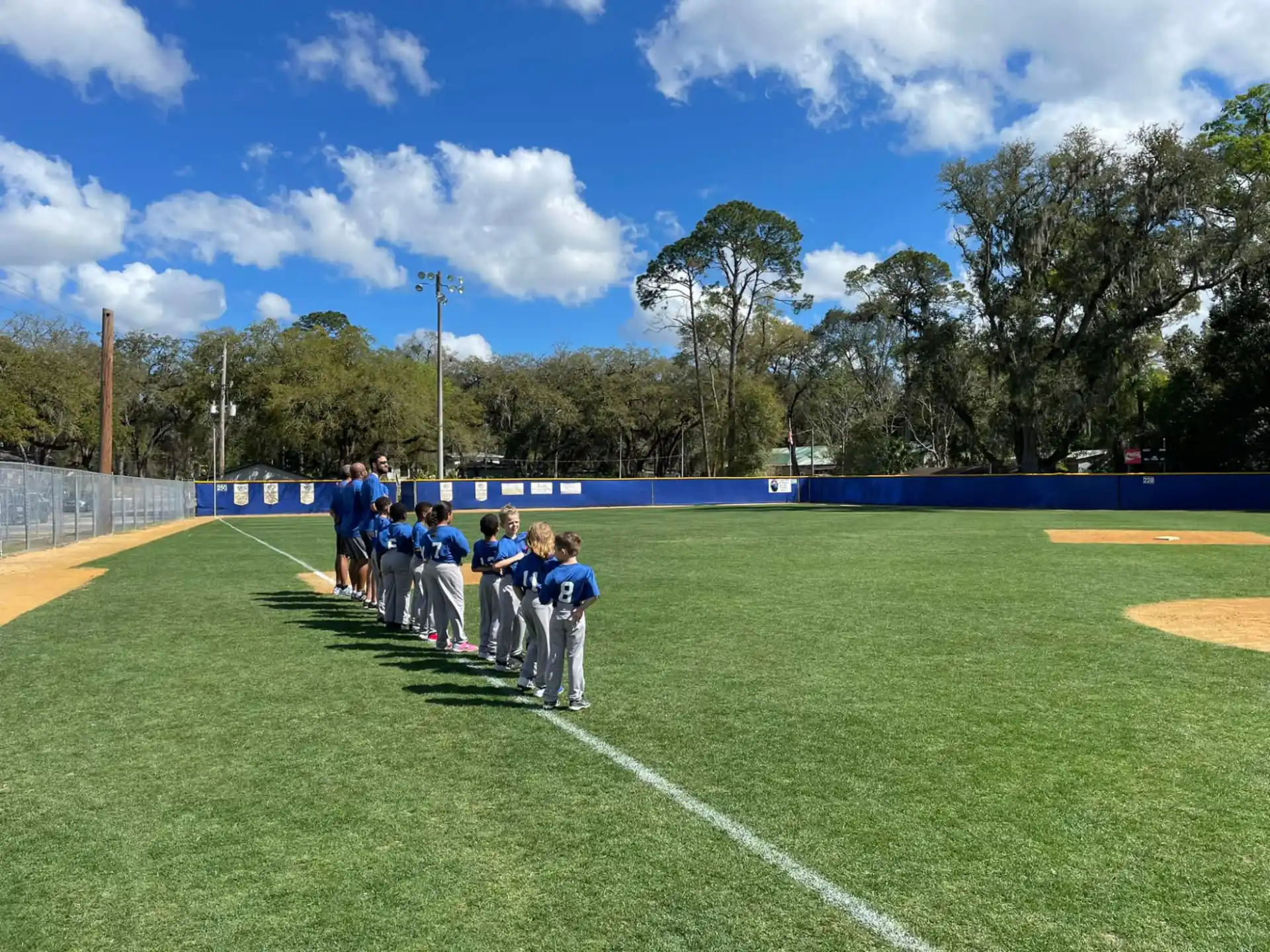 a group of people standing on a field