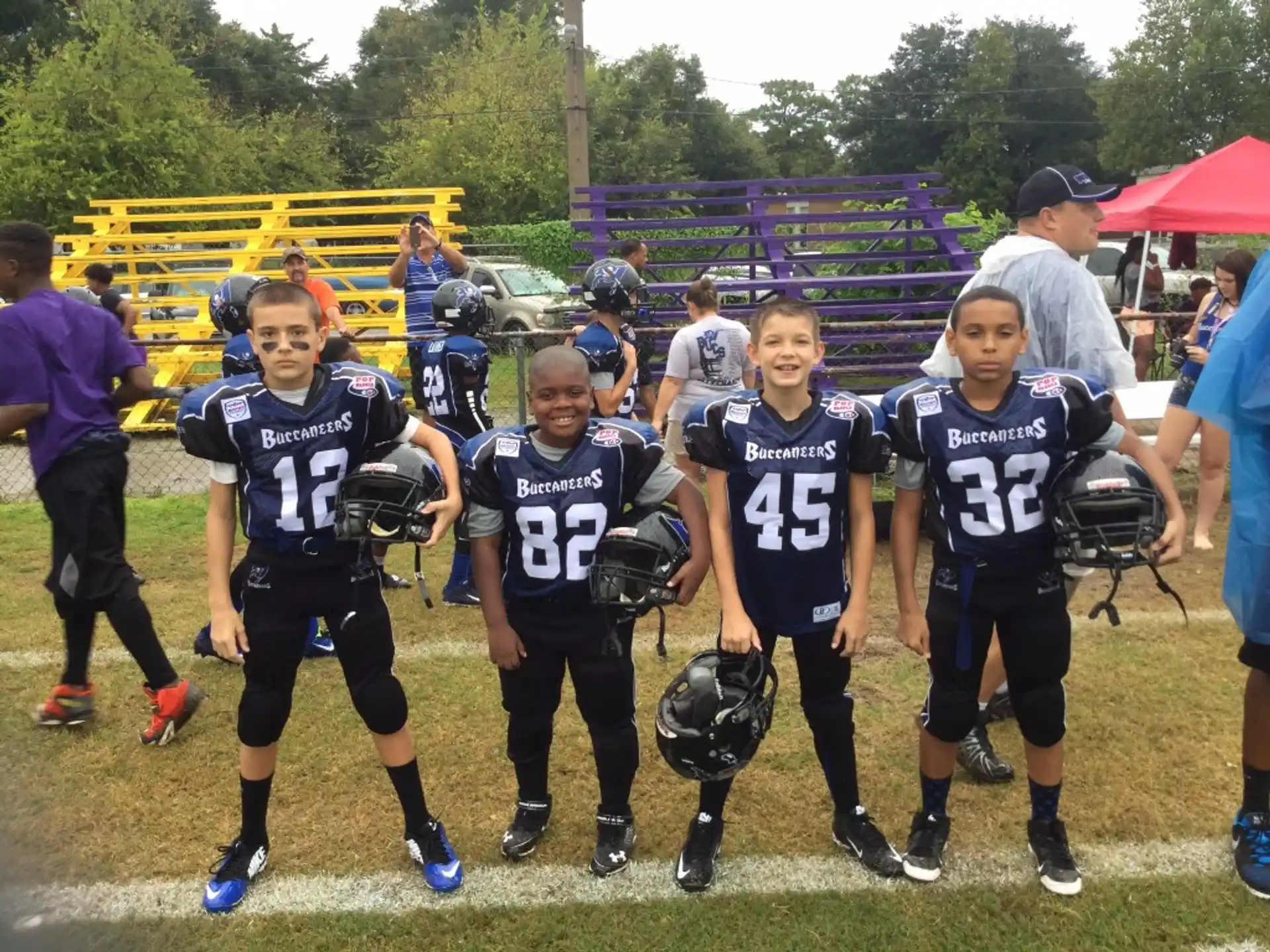 a group of kids wearing football gear