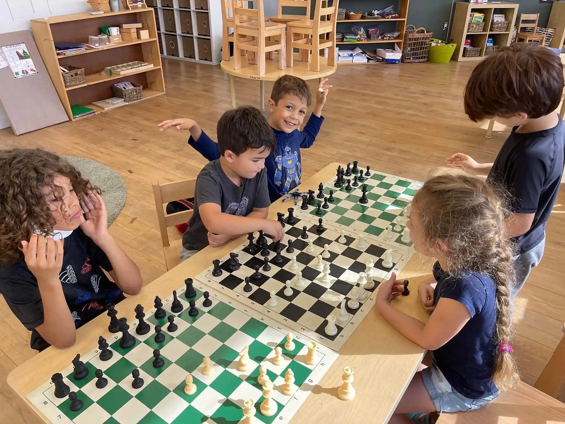 a group of children playing a board game