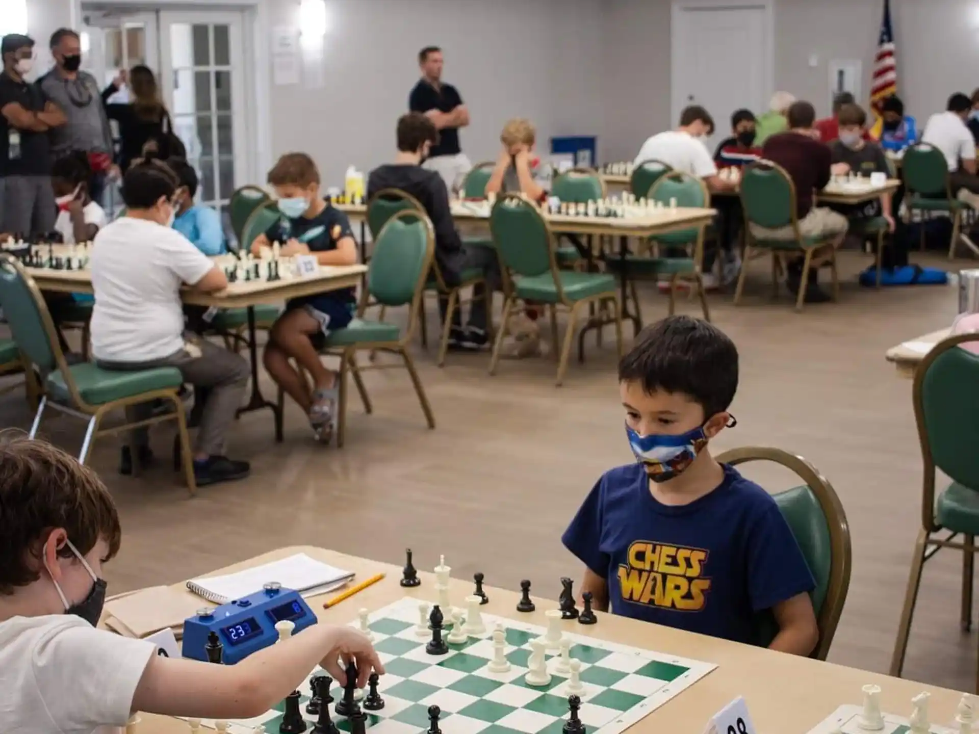 a group of people playing chess