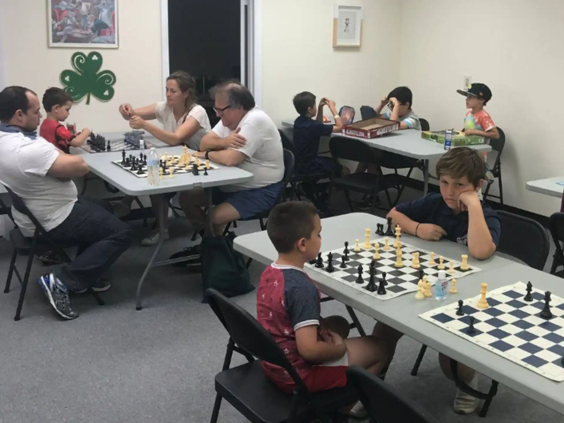 a group of people playing chess