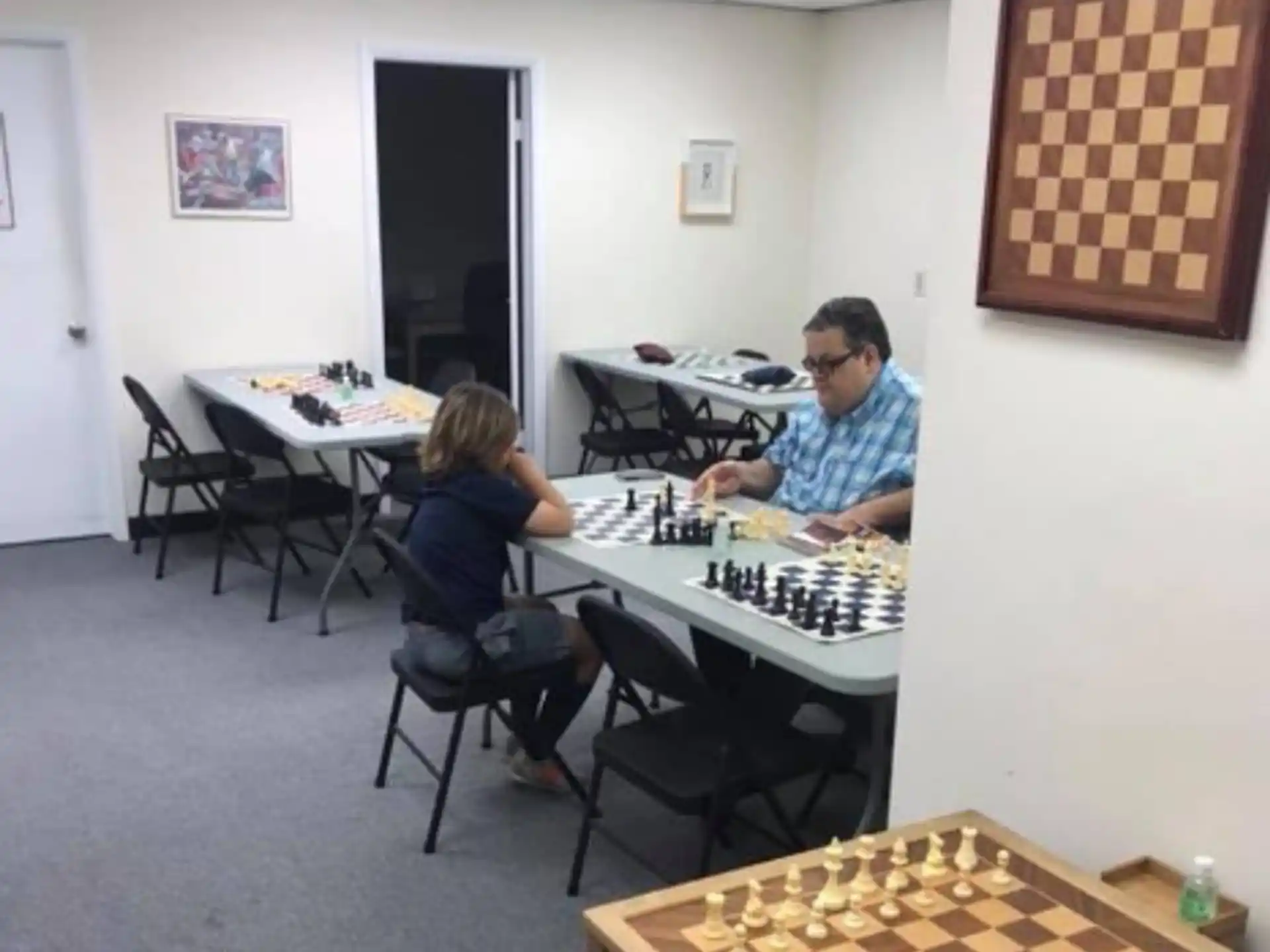 a man and a woman playing chess