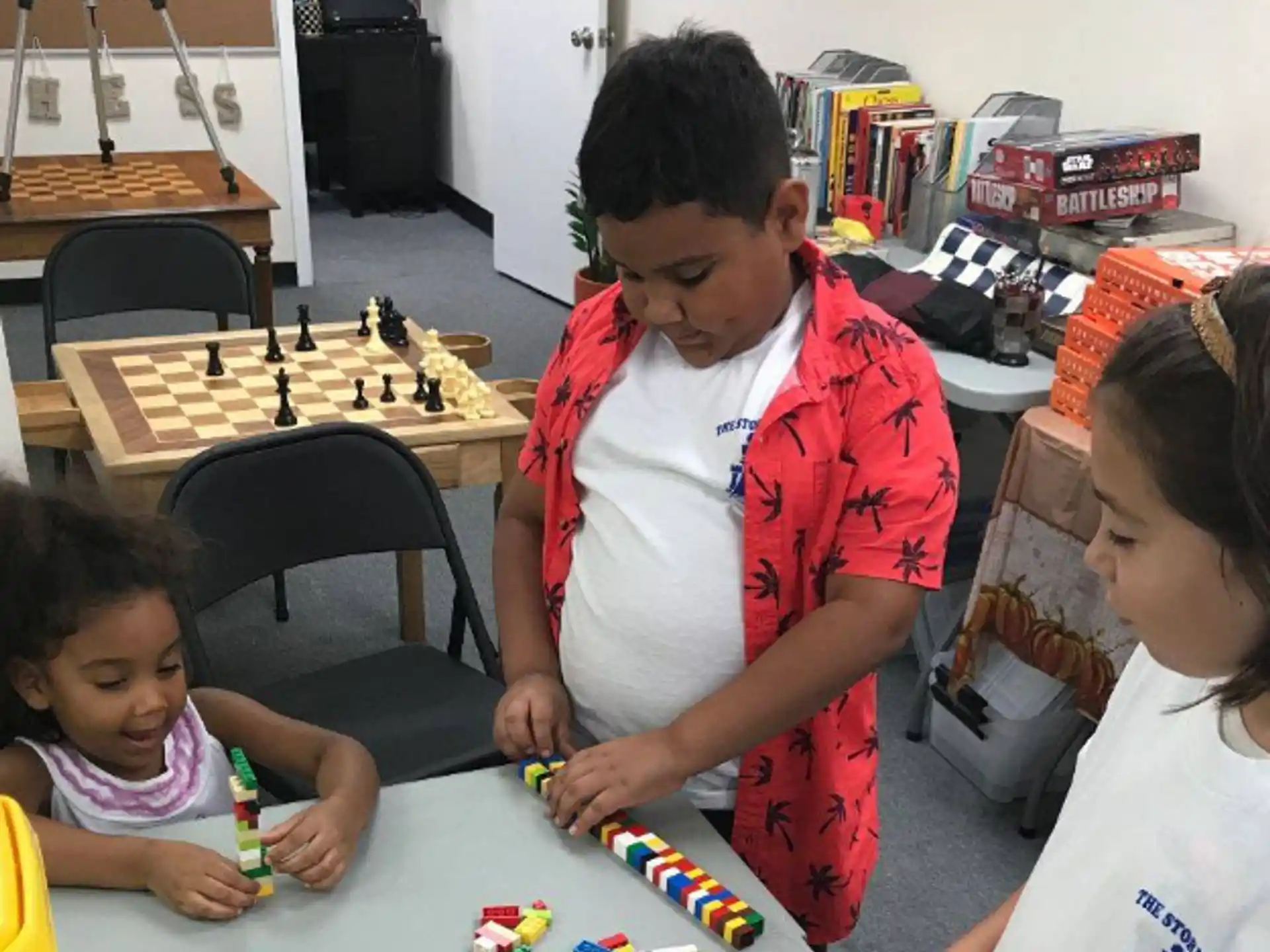 a person and children playing with toys
