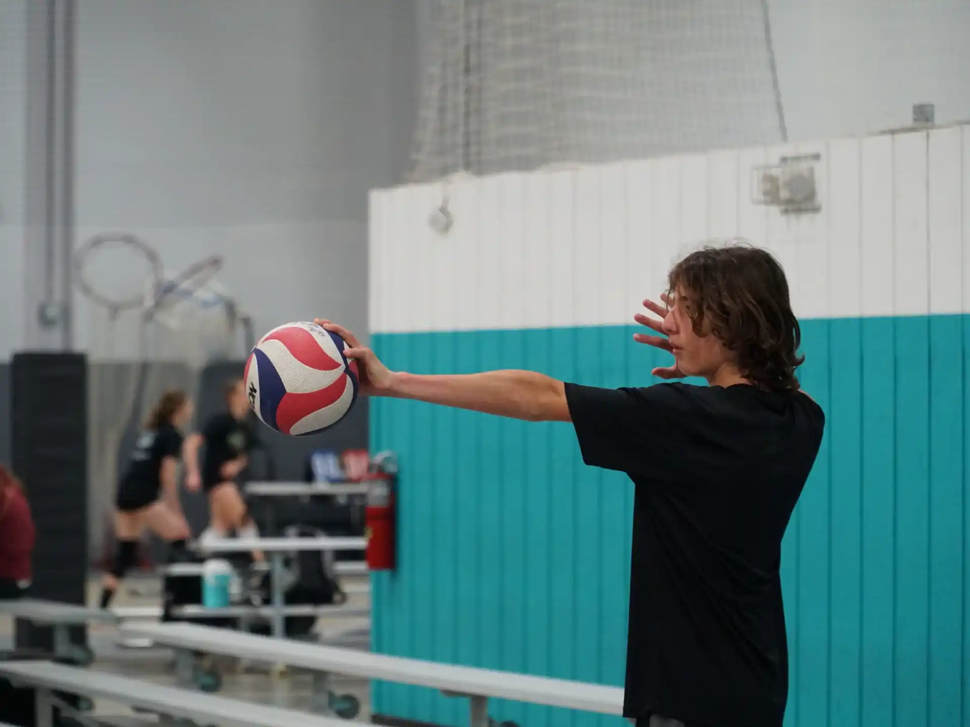 a man hitting a ball with his finger