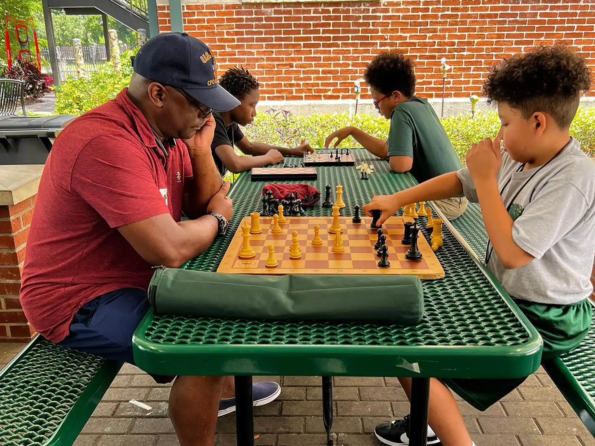 a group of people playing chess