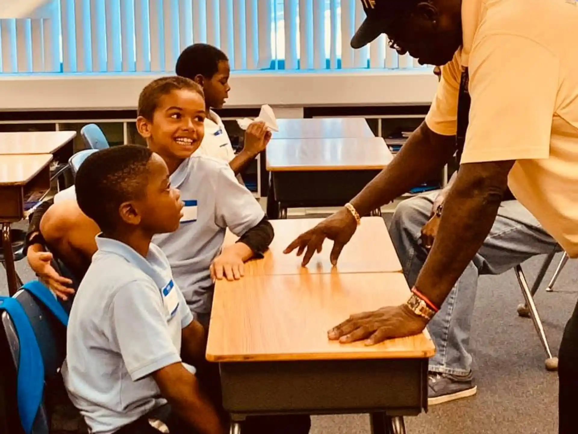 a person teaching a group of children
