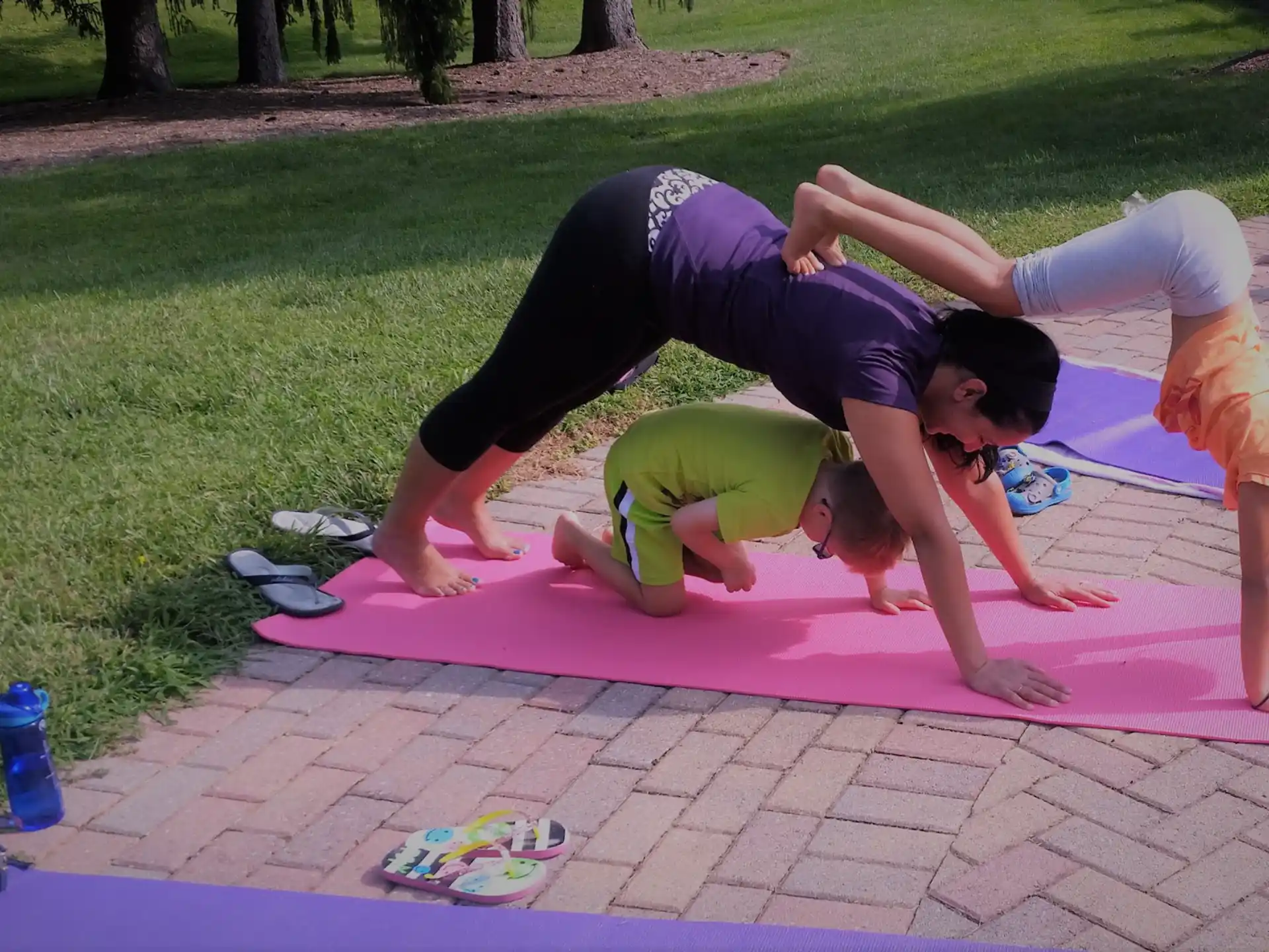 a group of people doing yoga outside