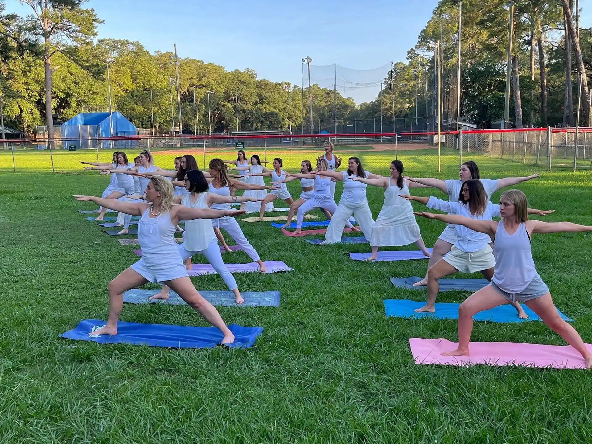 a group of people exercising on mats