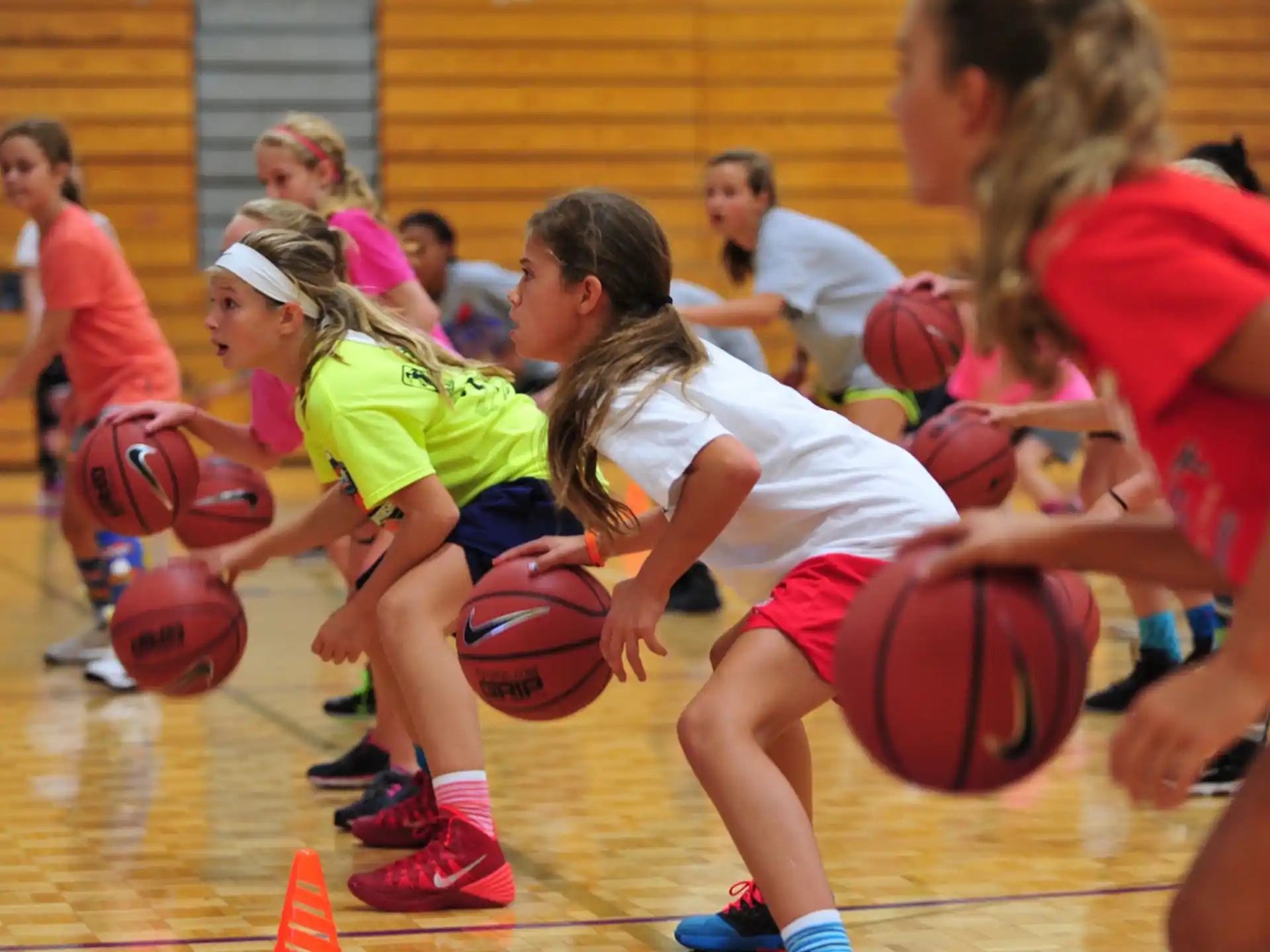 a group of women playing basketball