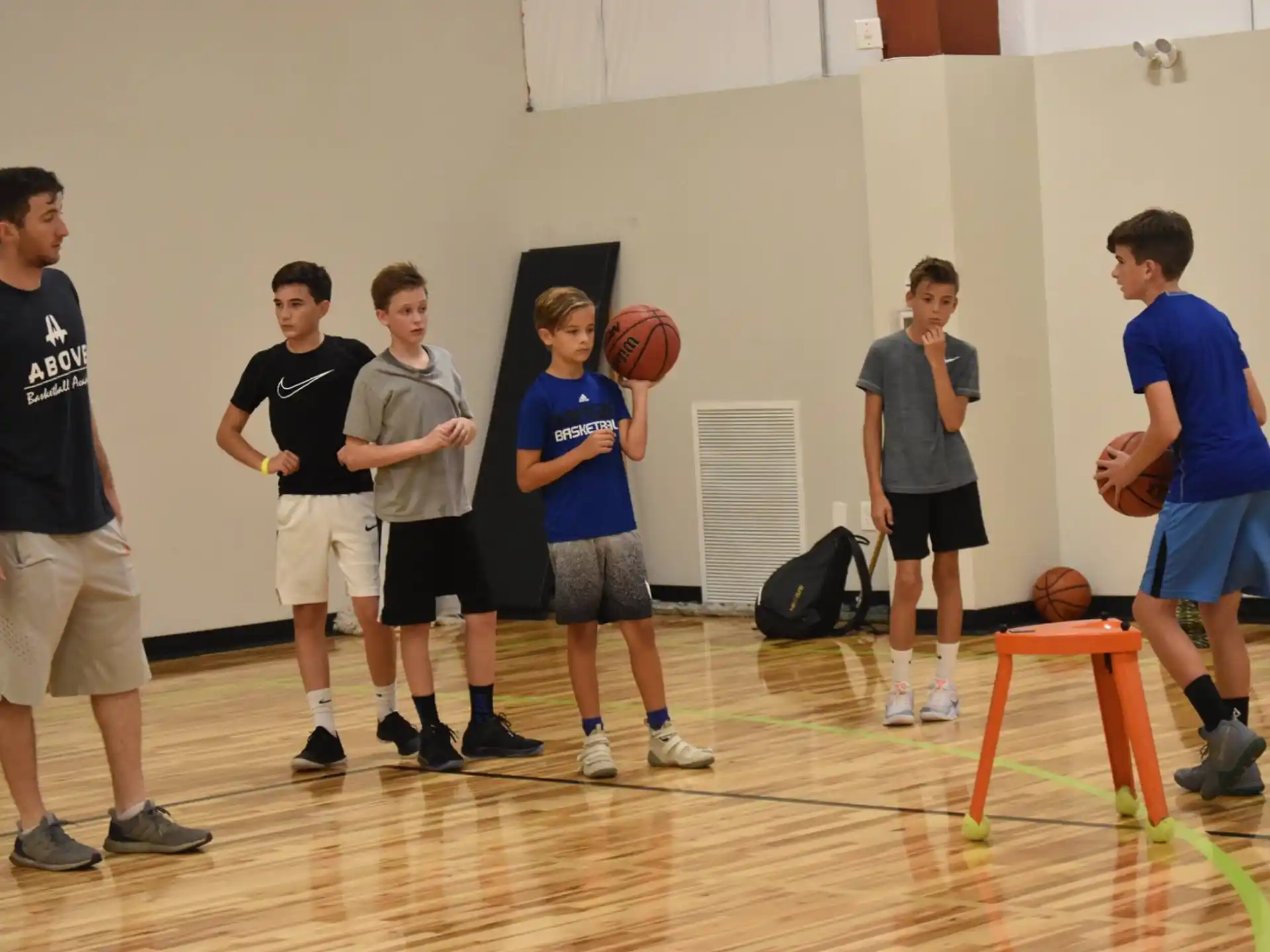 a group of boys playing basketball