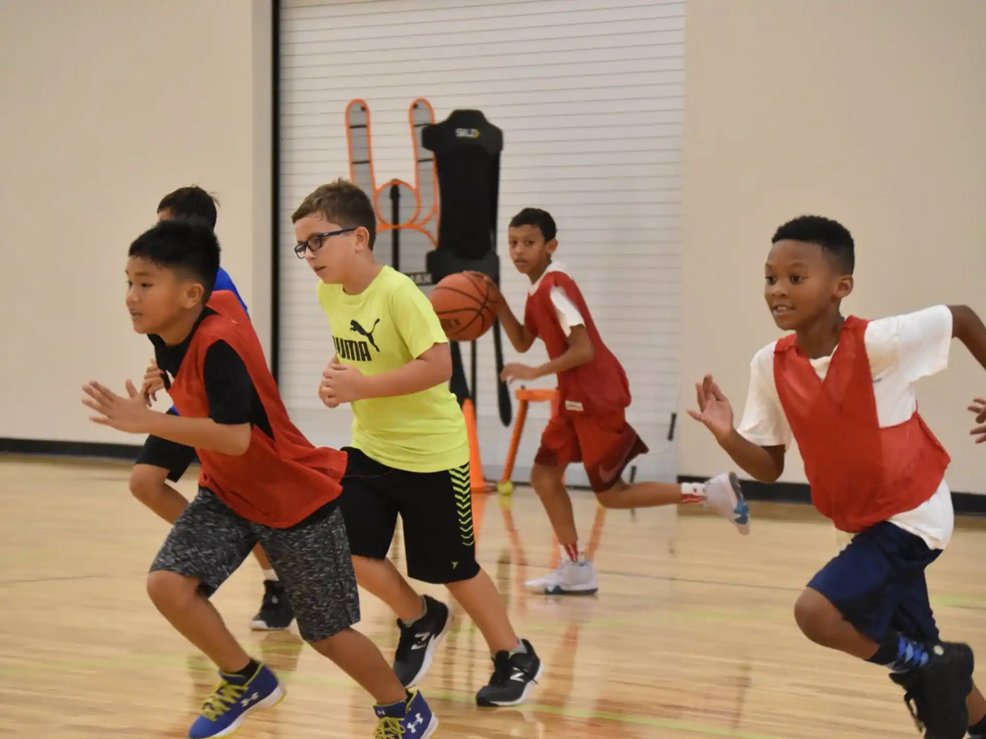 a group of boys playing basketball