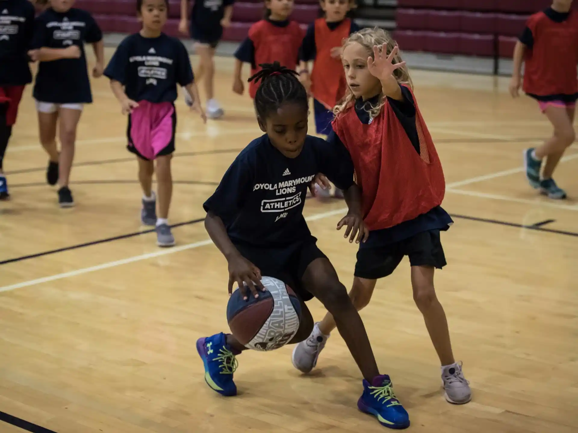 a group of people playing basketball