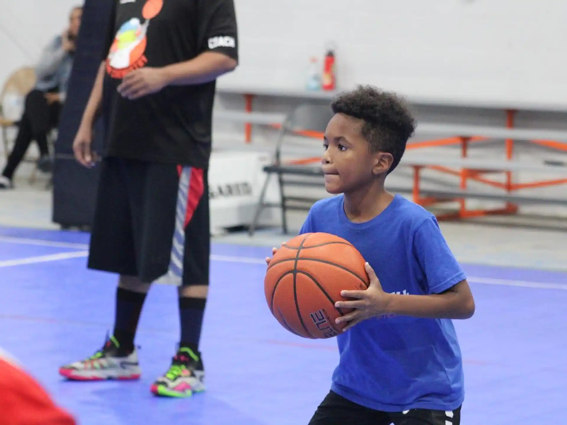 a boy holding a basketball