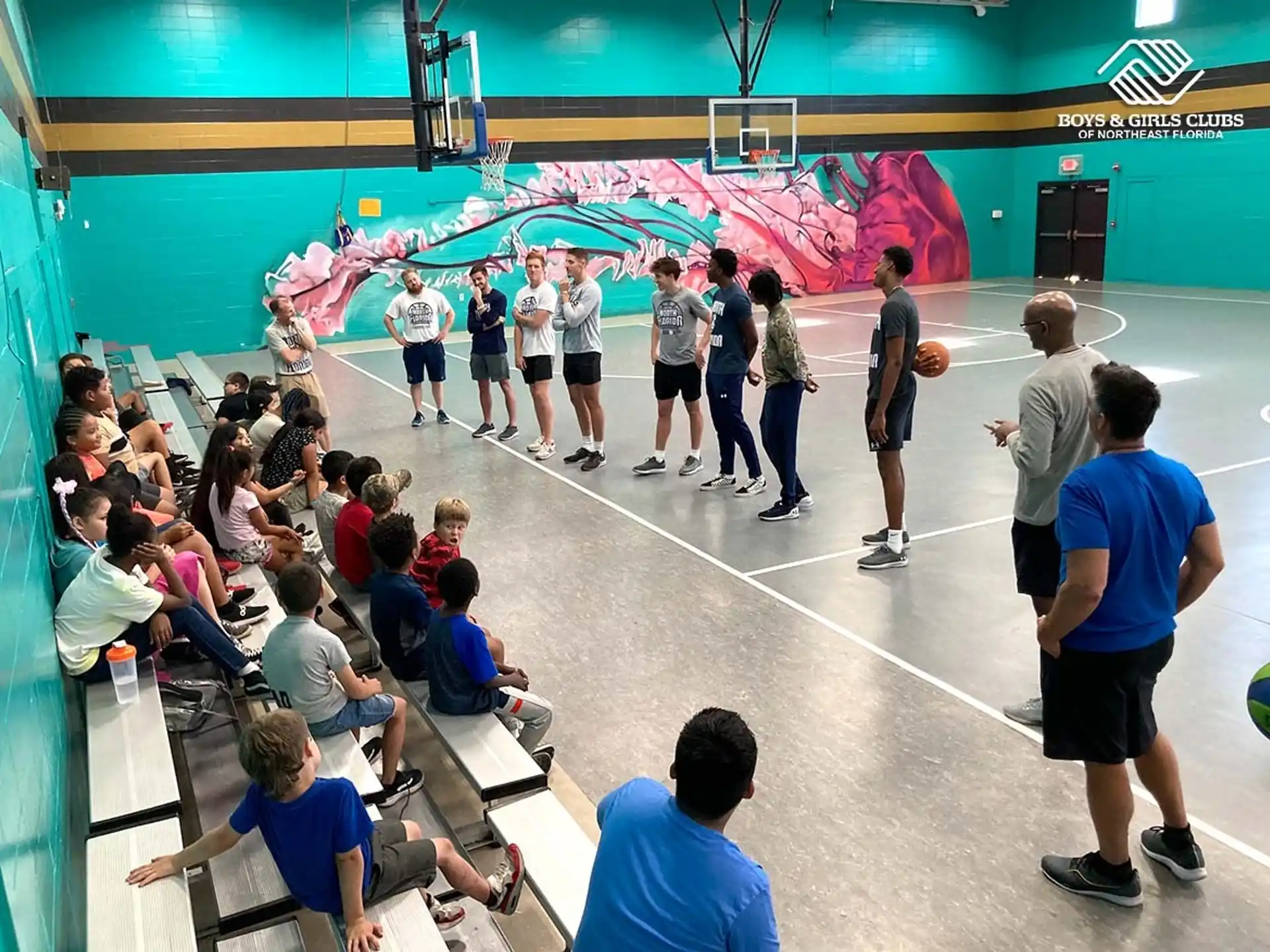 a group of people in a gym