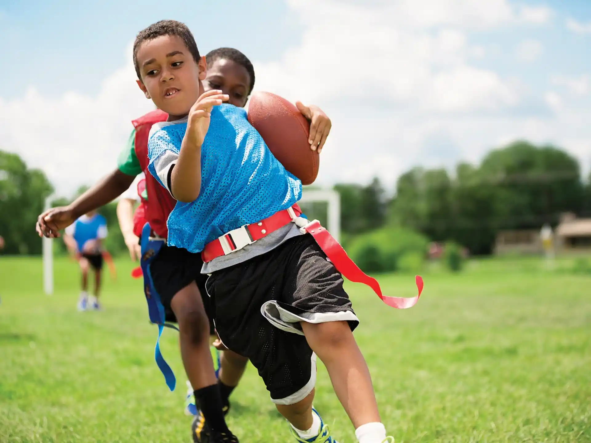 a group of boys playing football