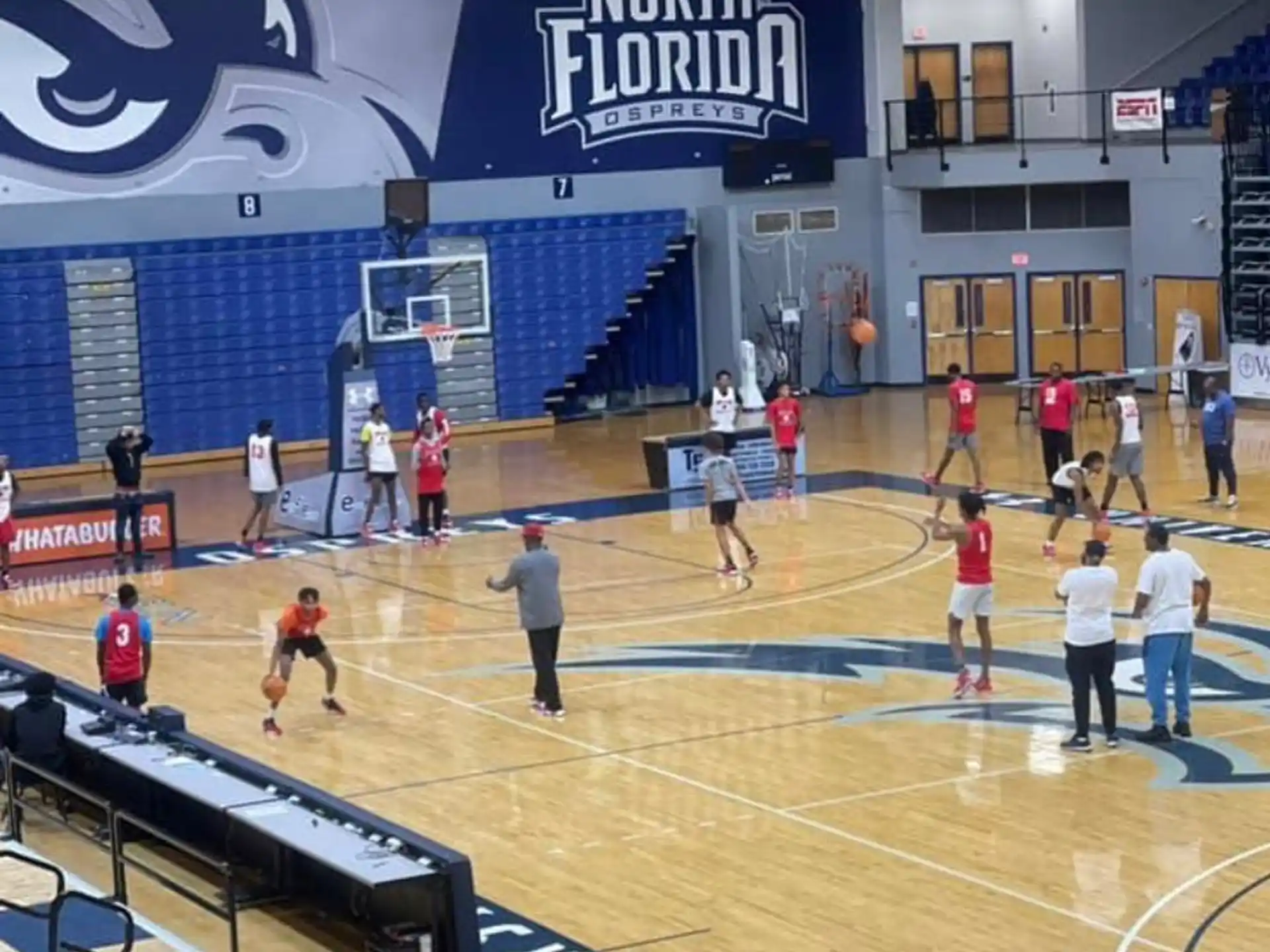 a group of people playing basketball