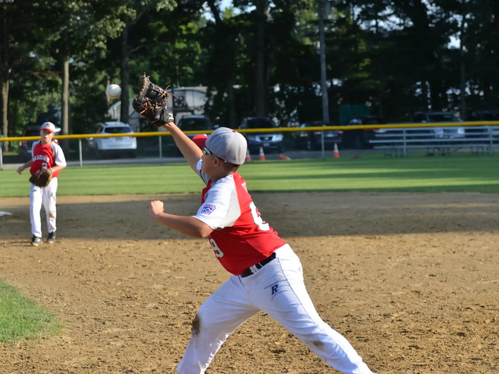 a kid throwing a baseball