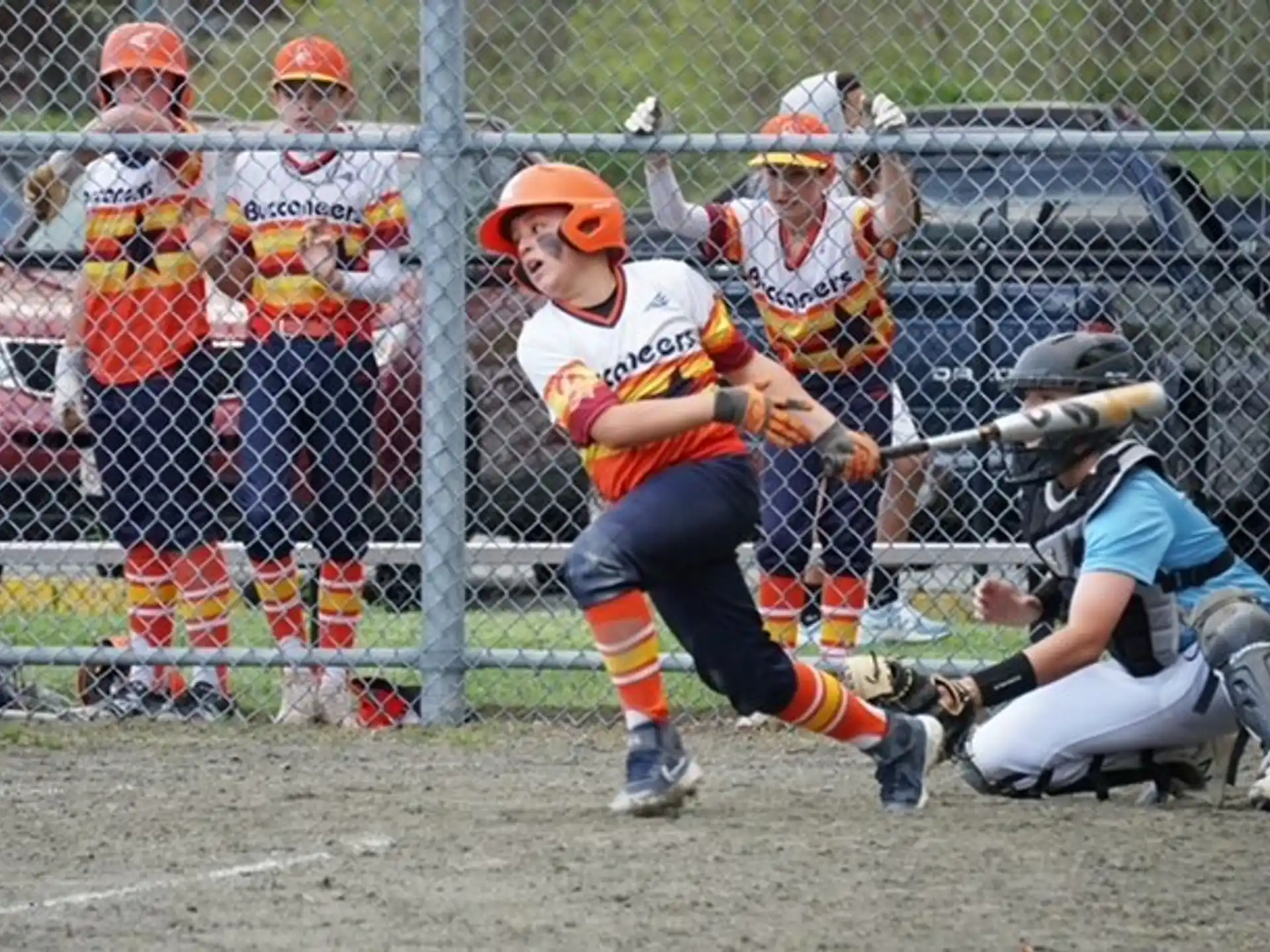 a person swinging a baseball bat