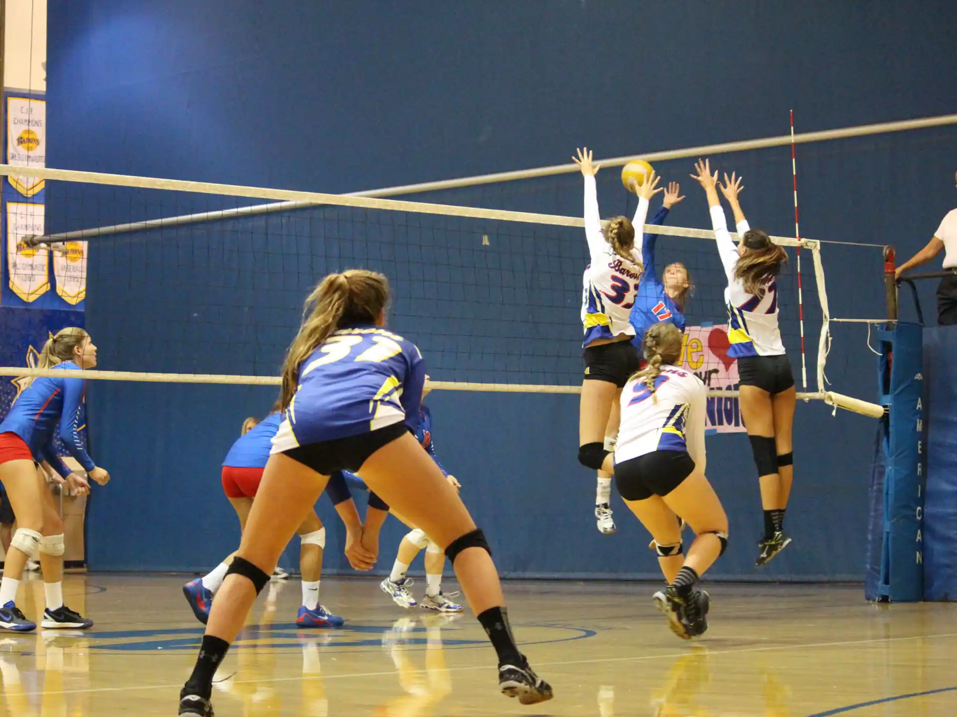 a group of women playing volleyball