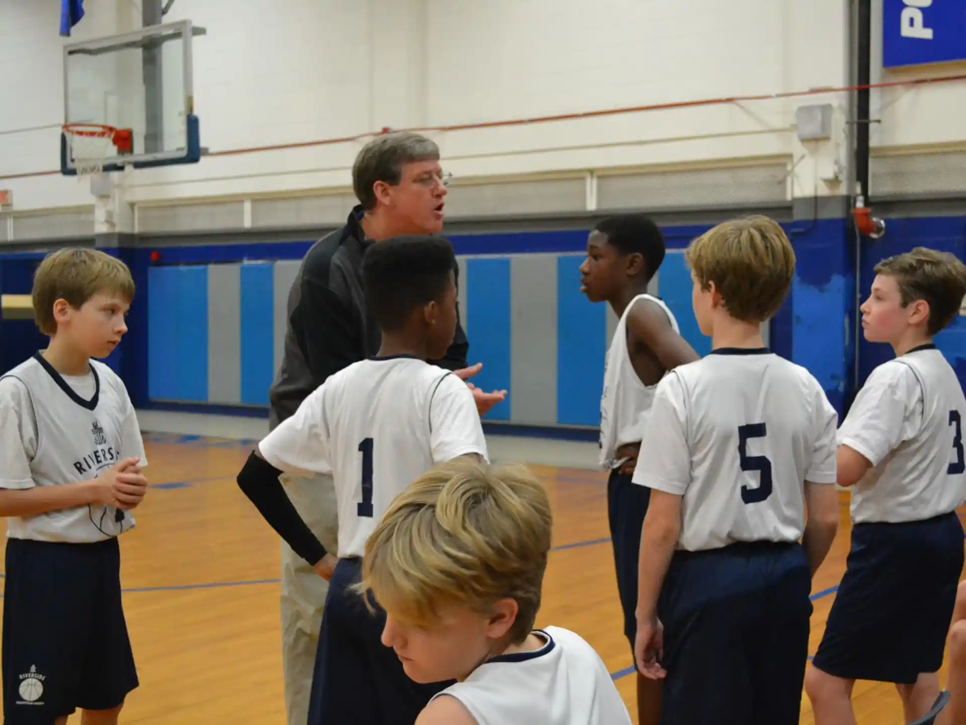 a group of boys in a gym