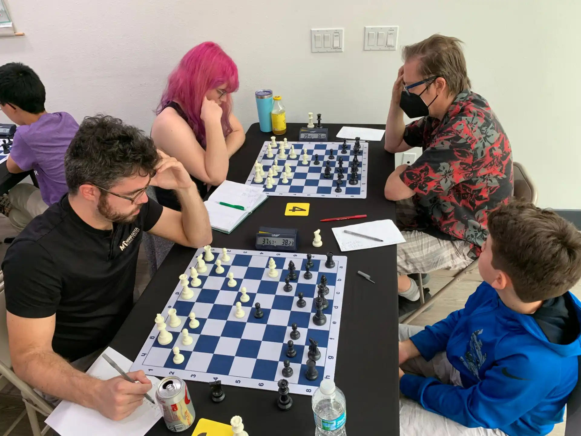 a group of people playing a board game