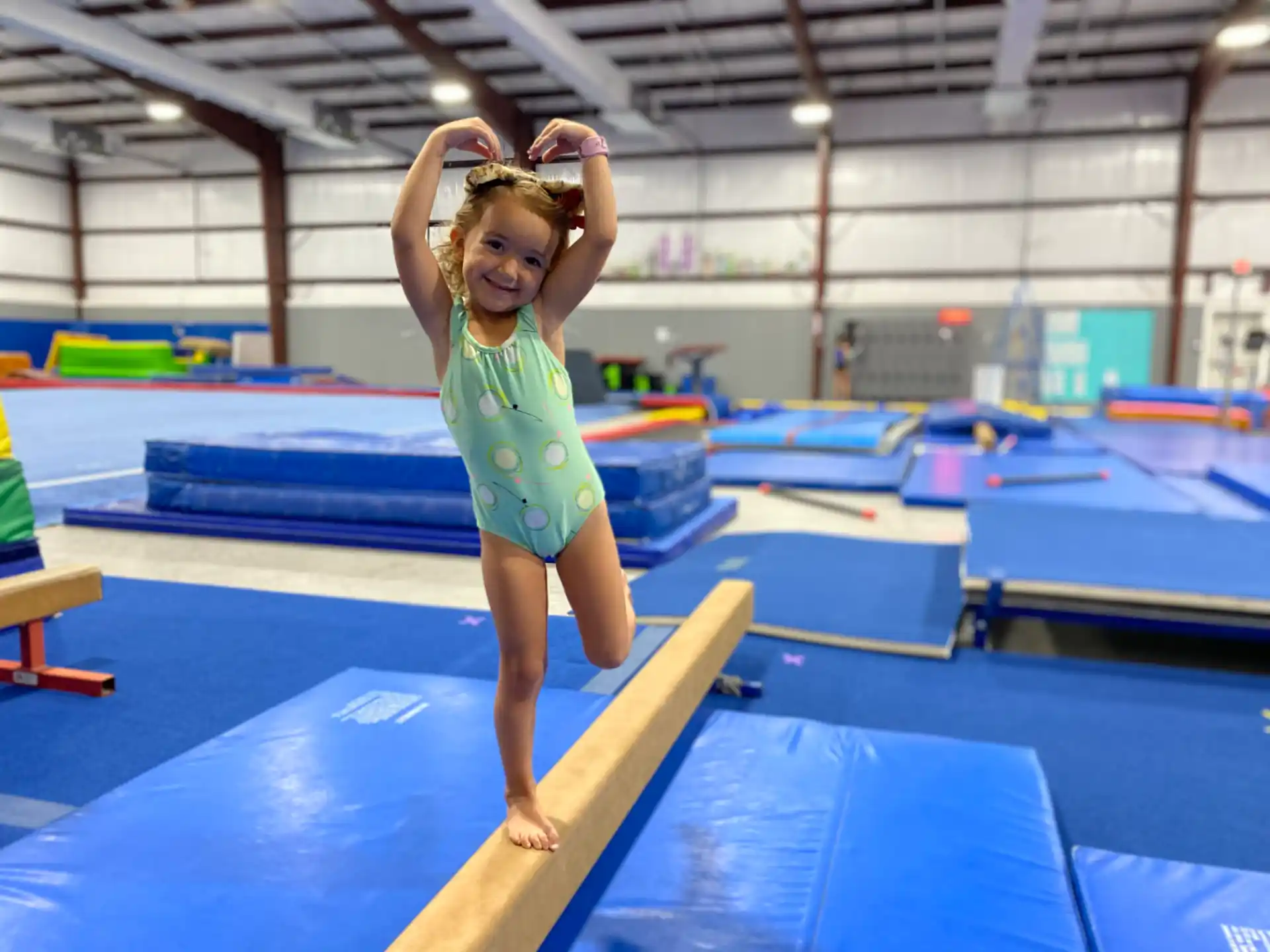 a girl standing on a wooden platform
