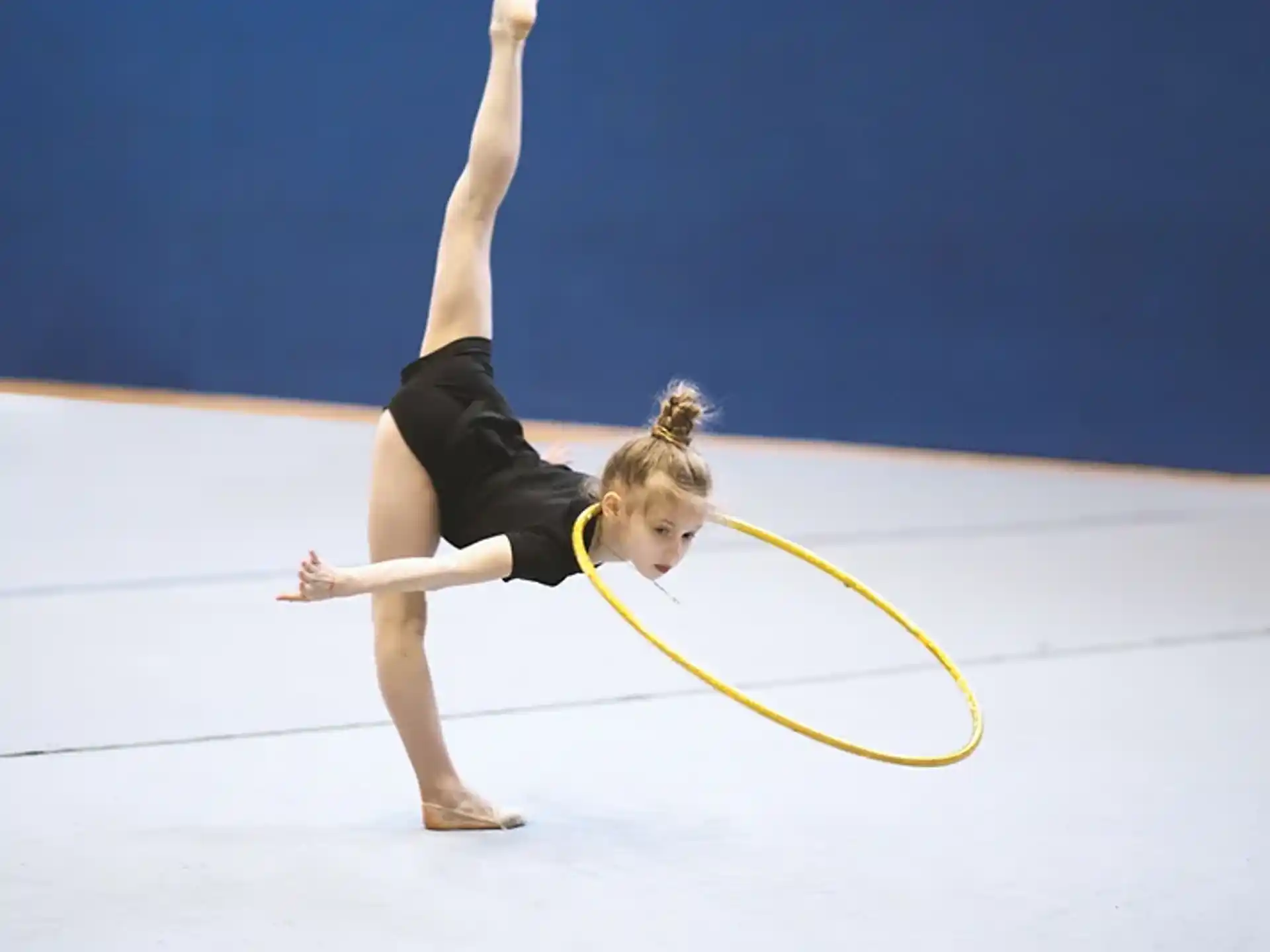 a person doing a handstand on a stage