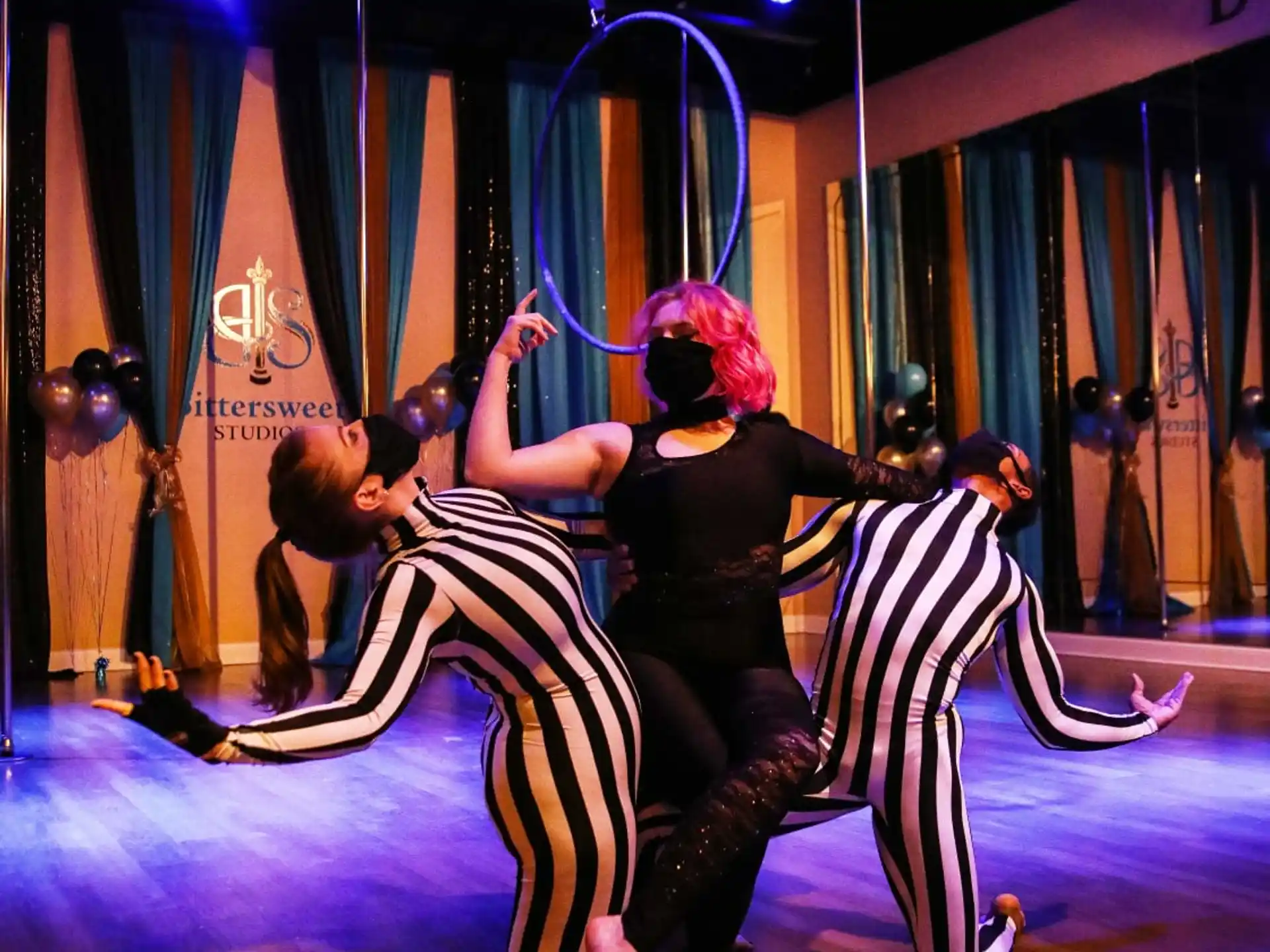 a group of people dancing on a stage