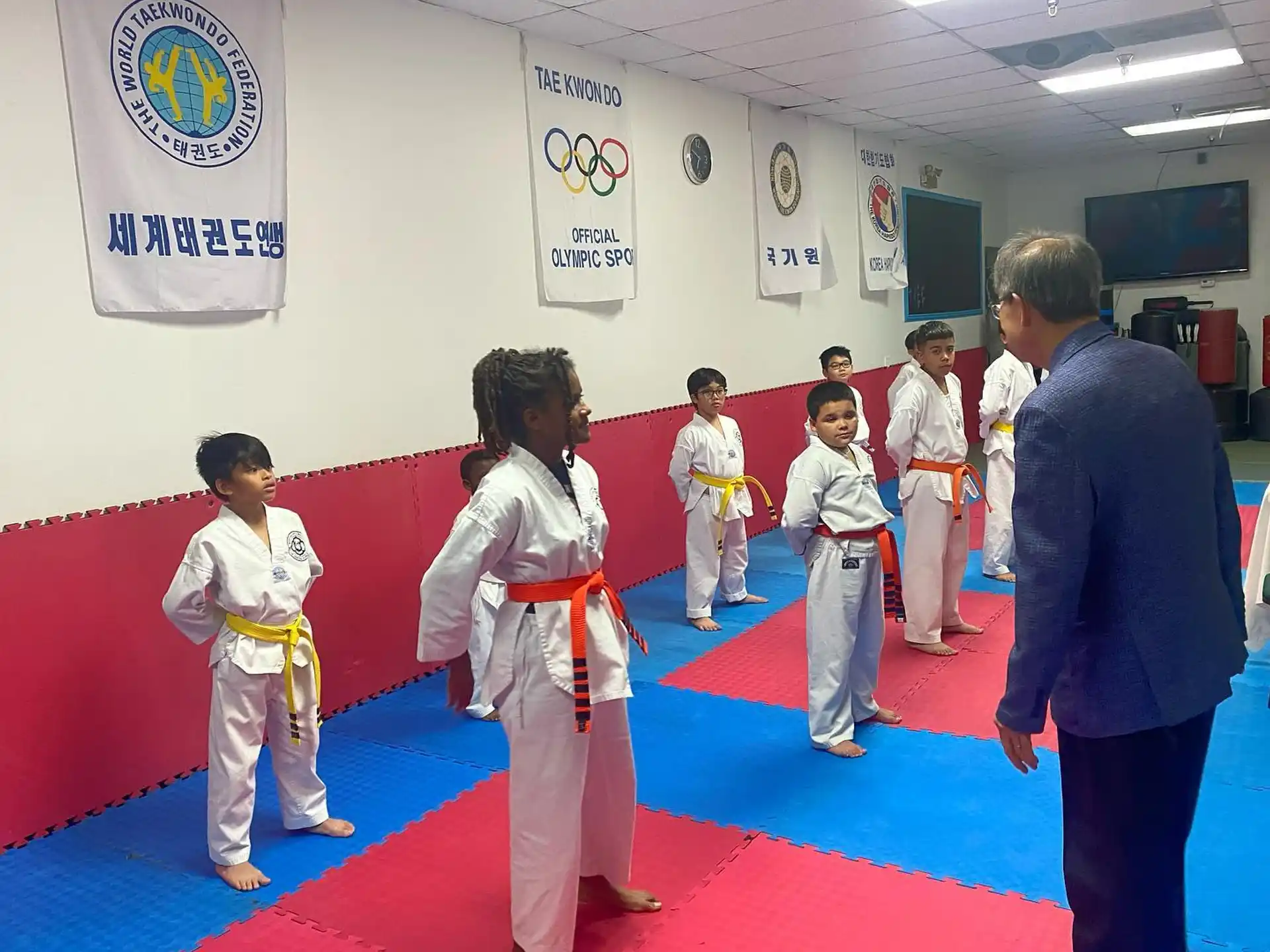 a group of people in karate uniforms