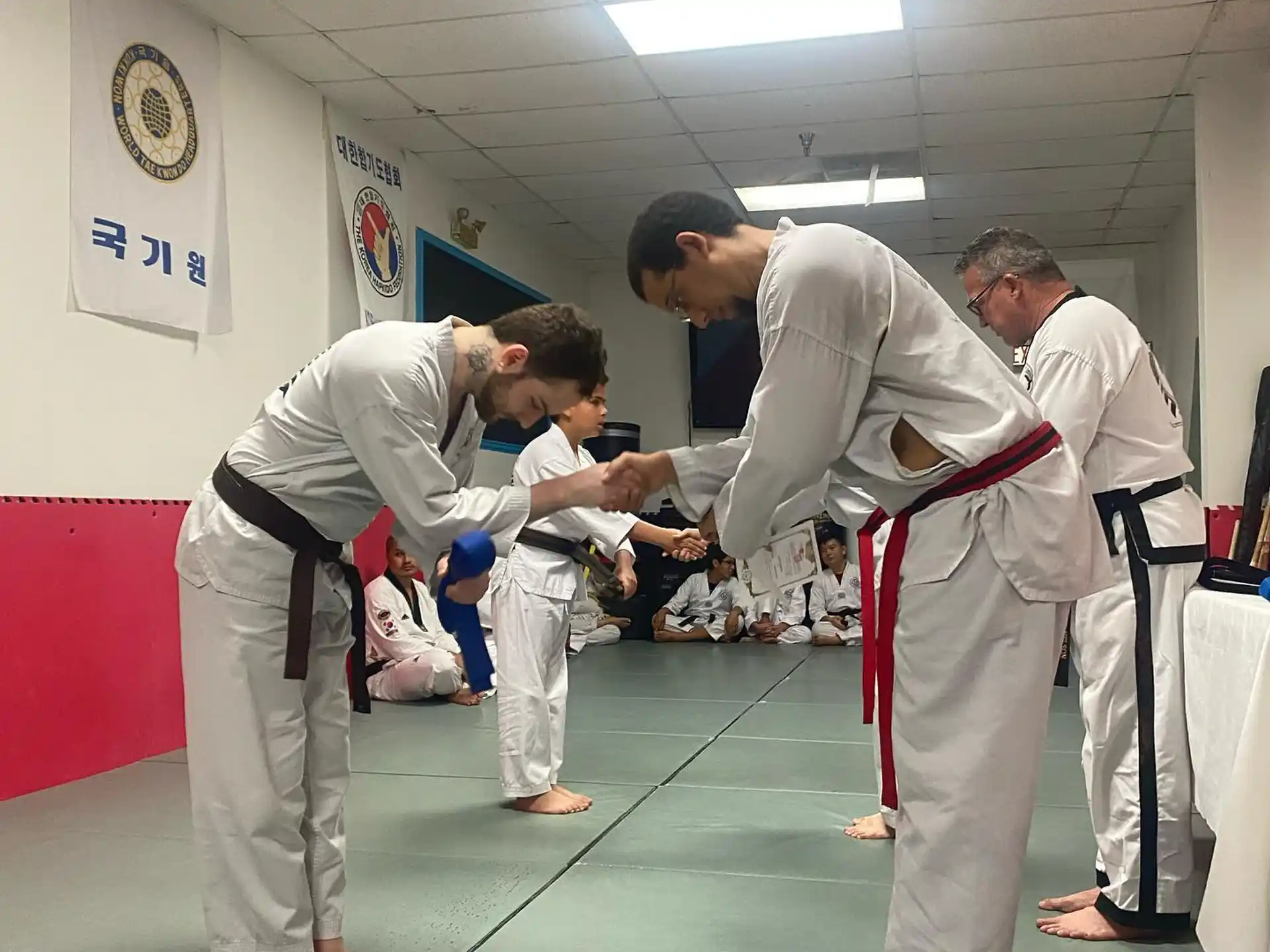 a group of people in karate uniforms