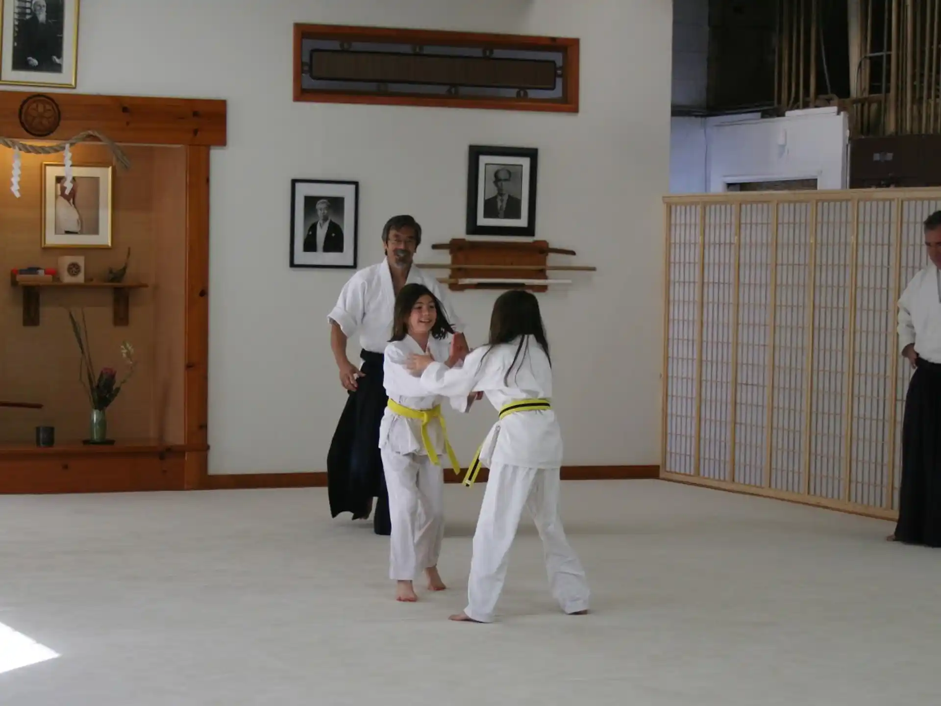 a group of people in karate uniforms