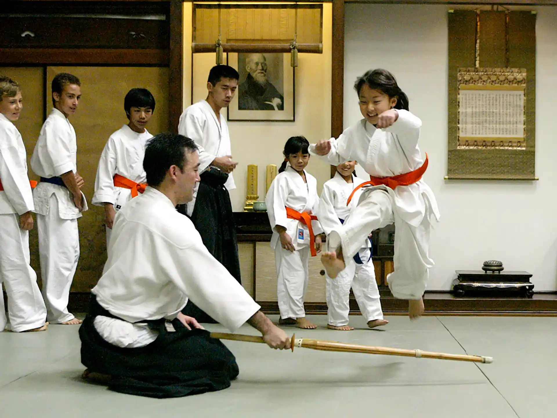 a group of people in karate uniforms