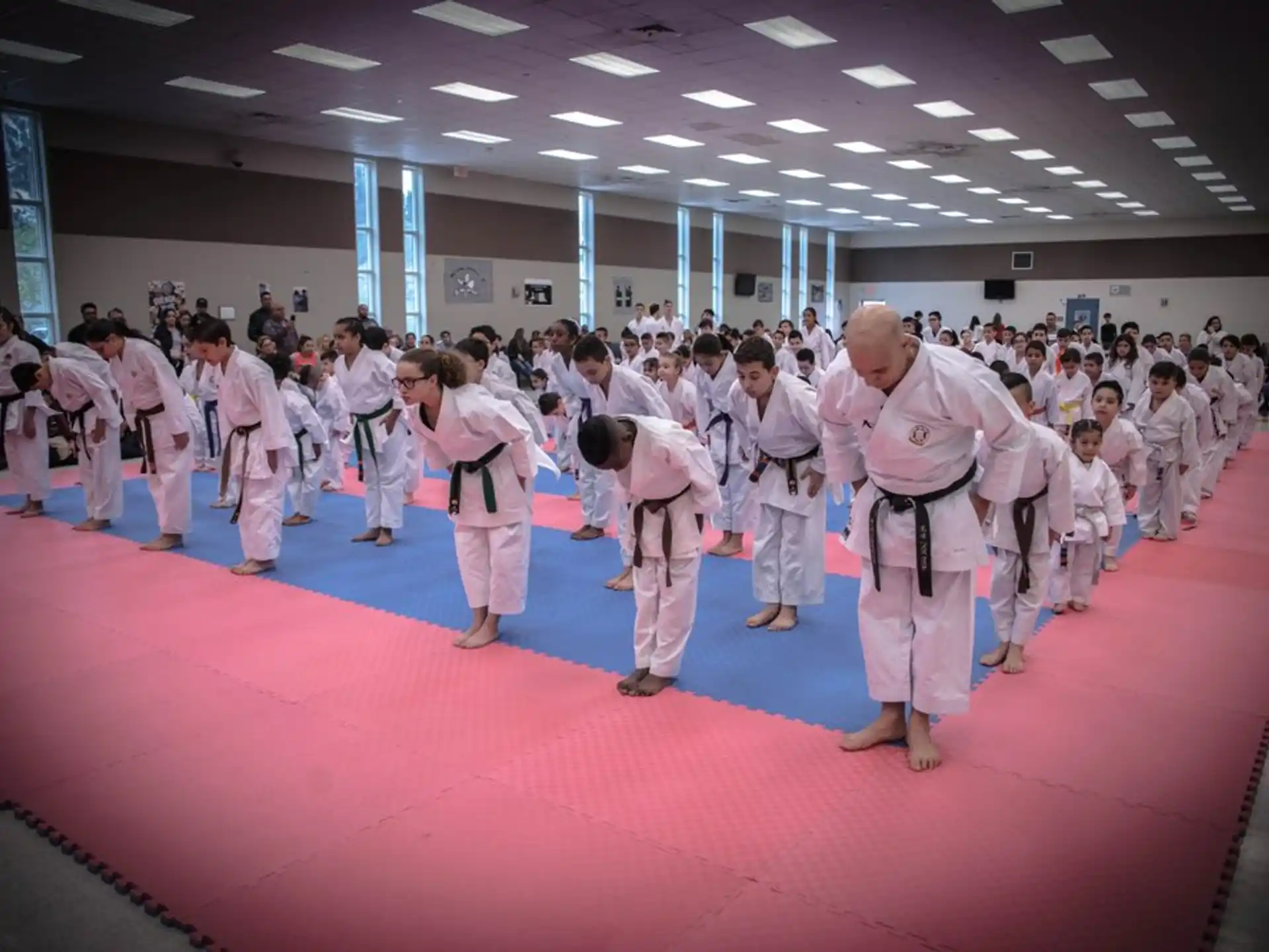 a group of people in karate uniforms