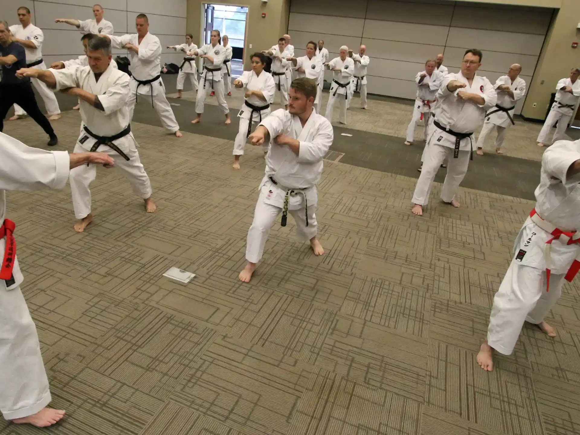 a group of people in karate uniforms