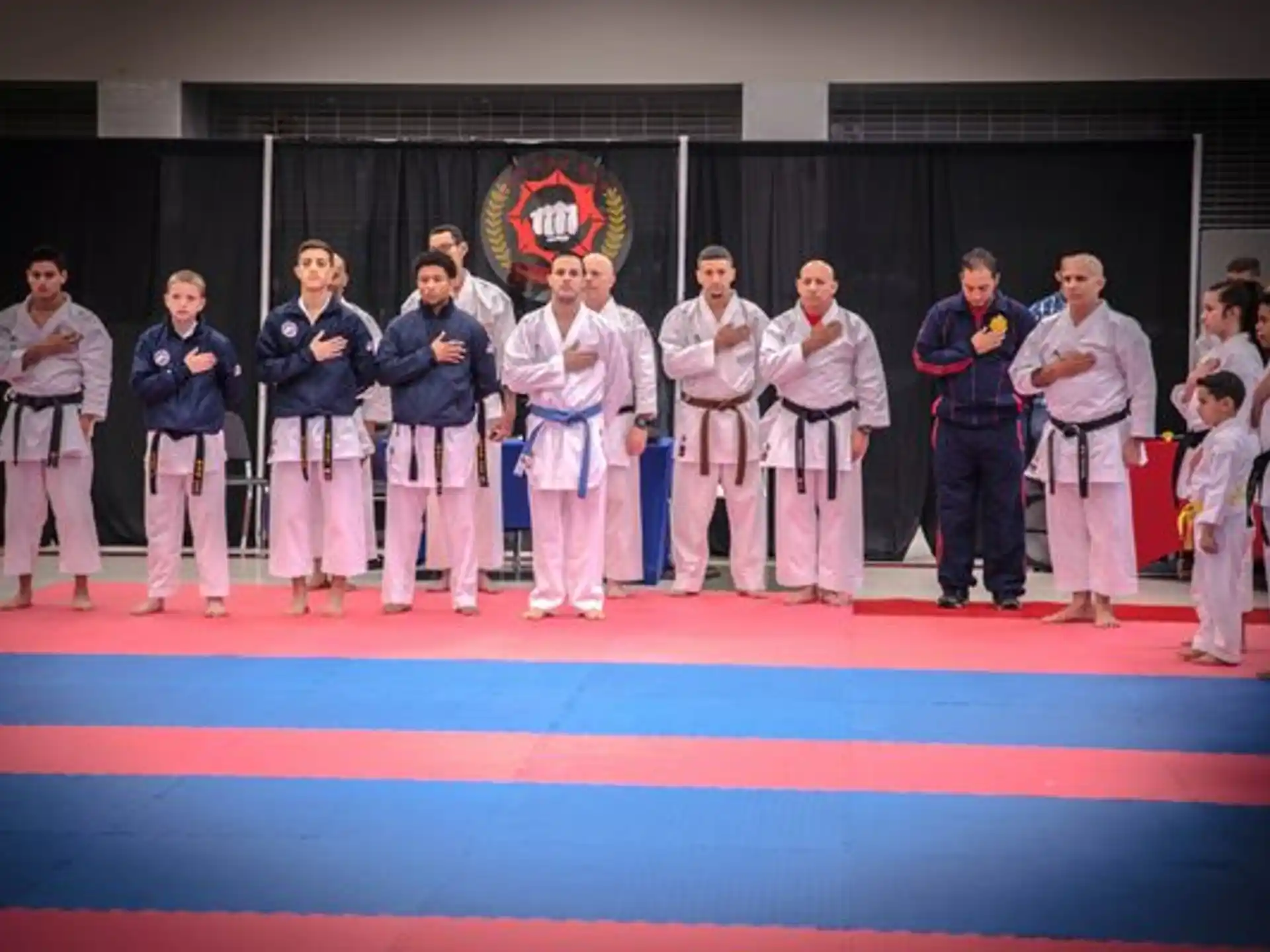 a group of people in karate uniforms