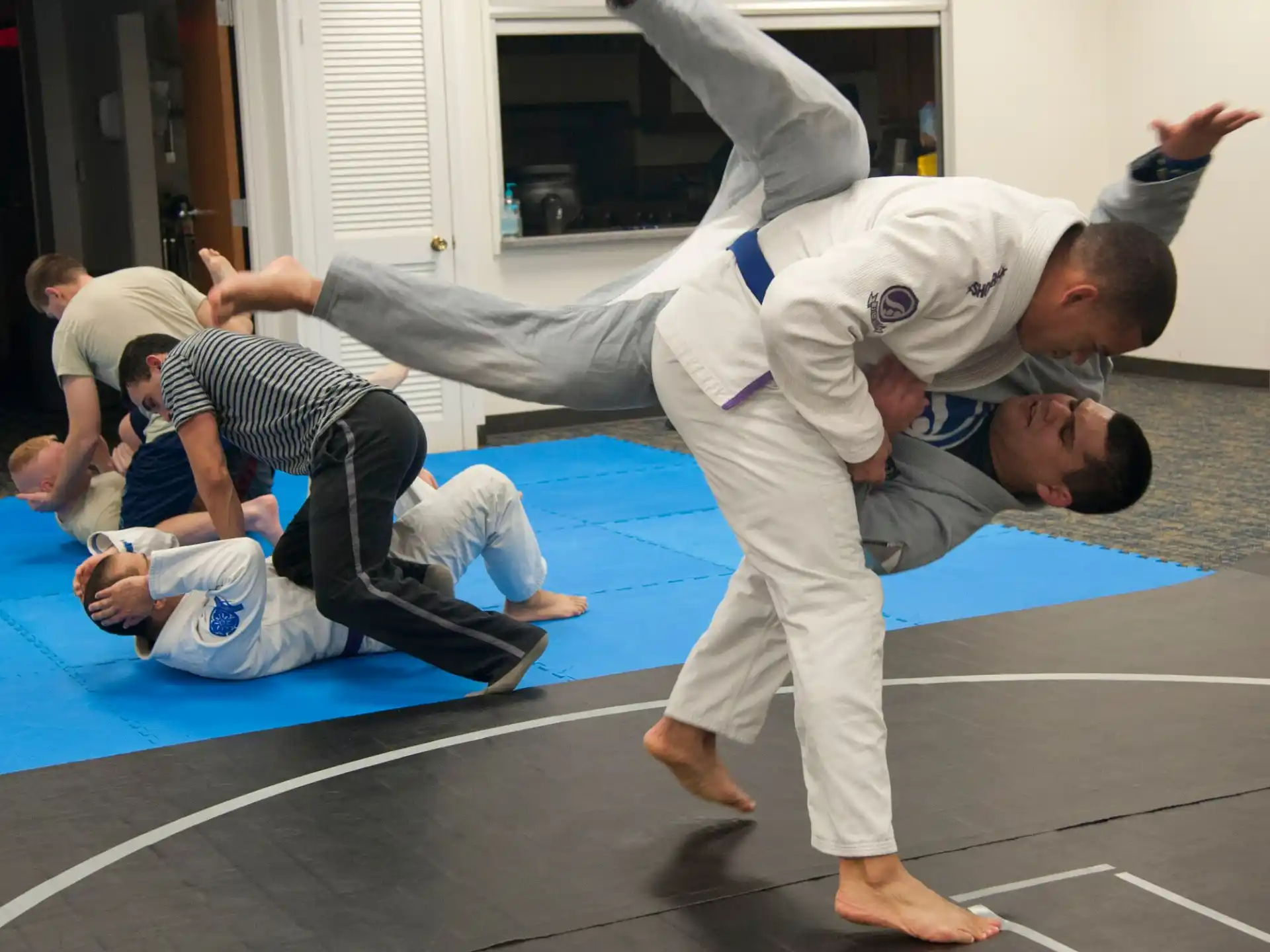 a group of people in karate uniforms