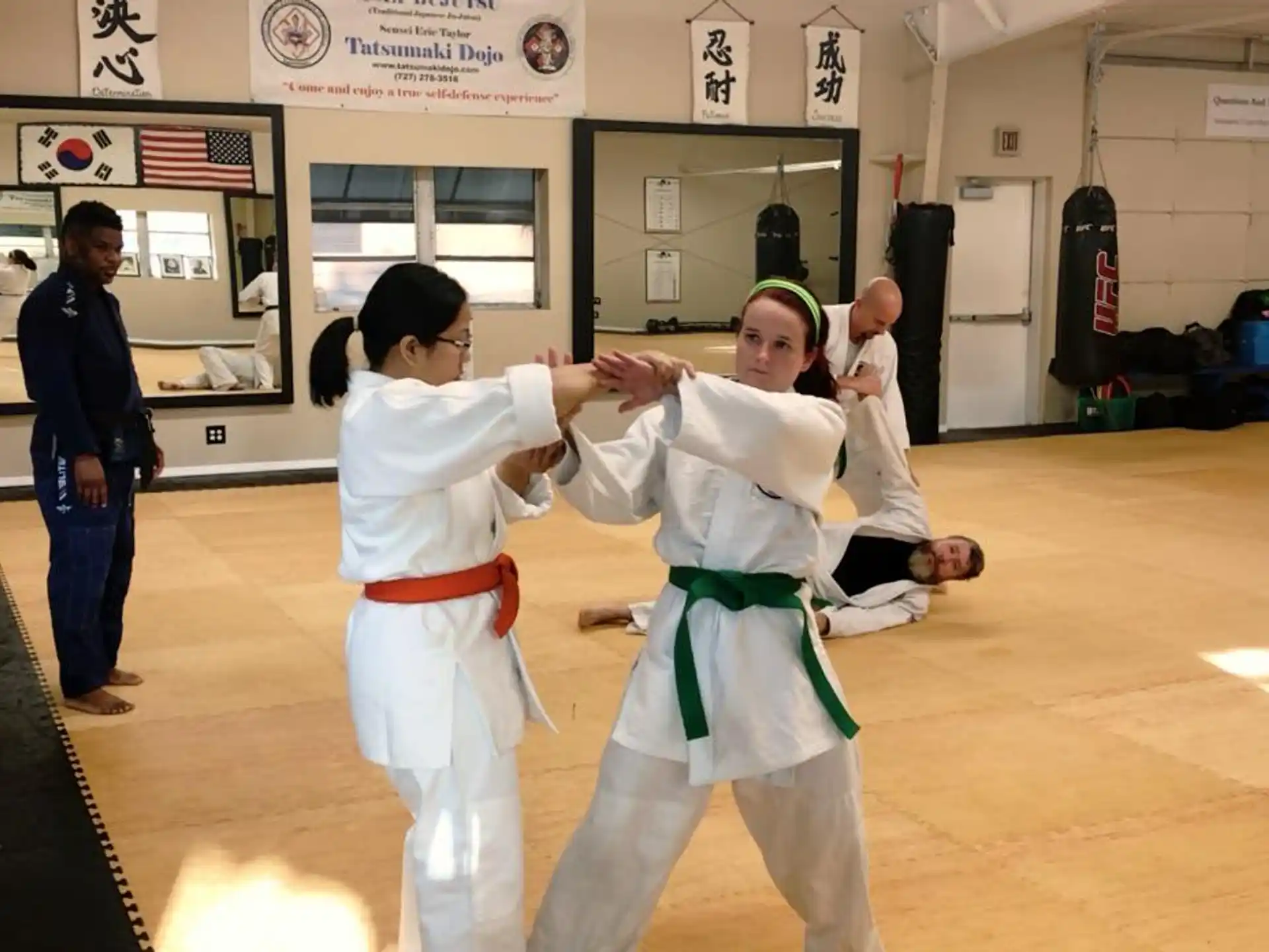 a group of people in karate uniforms